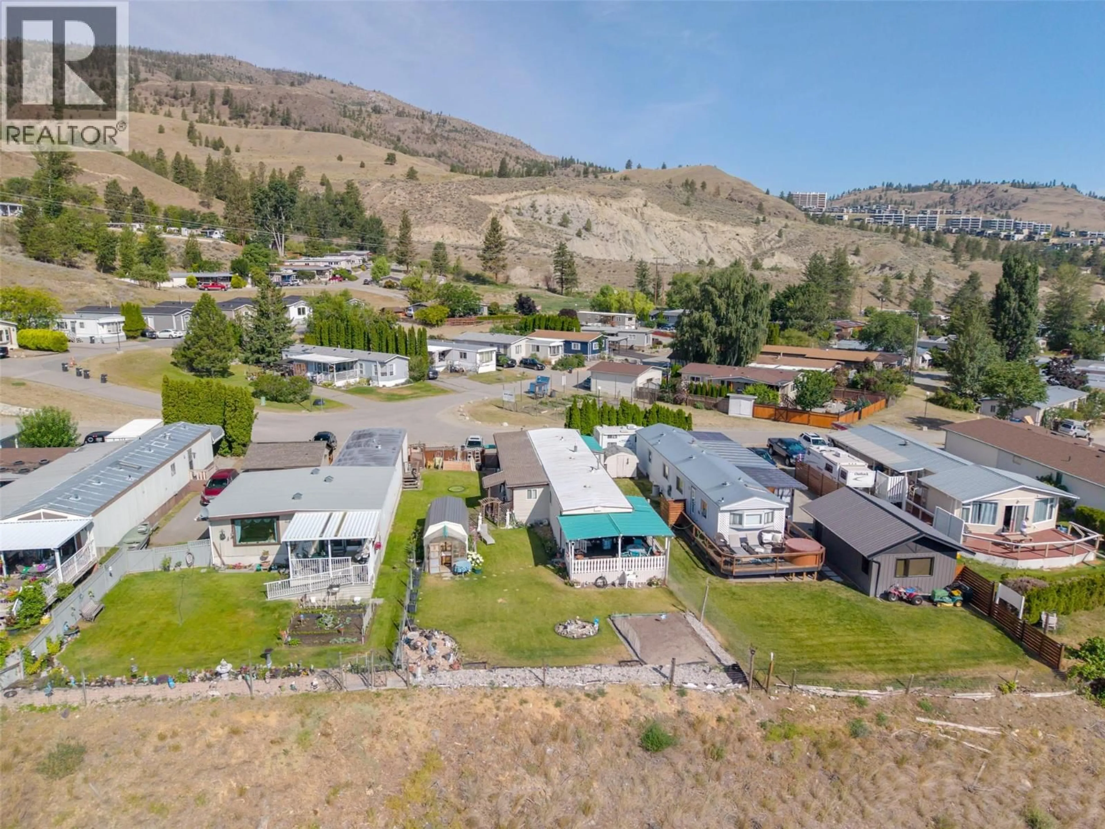 A pic from outside/outdoor area/front of a property/back of a property/a pic from drone, mountain view for 35 - 201 HIGHWAY 97 OTHER, Penticton British Columbia V2A0E4