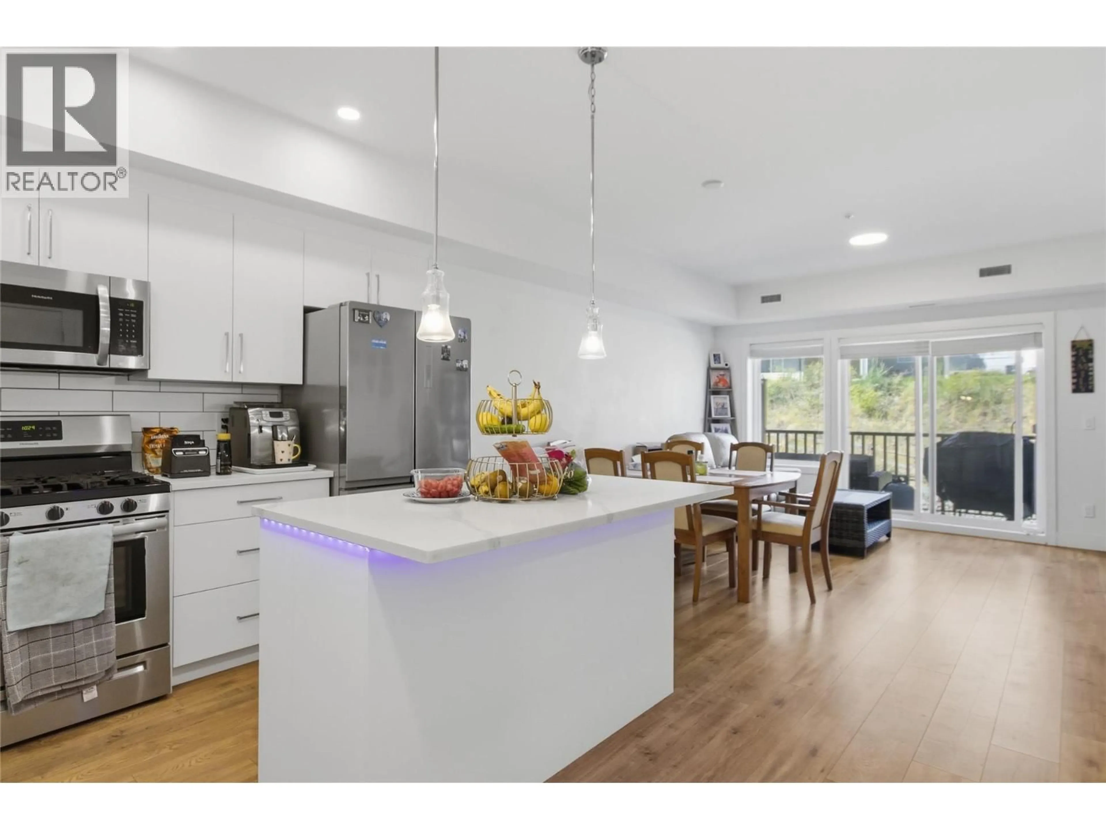 Open concept kitchen, wood/laminate floor for 216 - 2046 ROBSON PLACE, Kamloops British Columbia V2E0A5