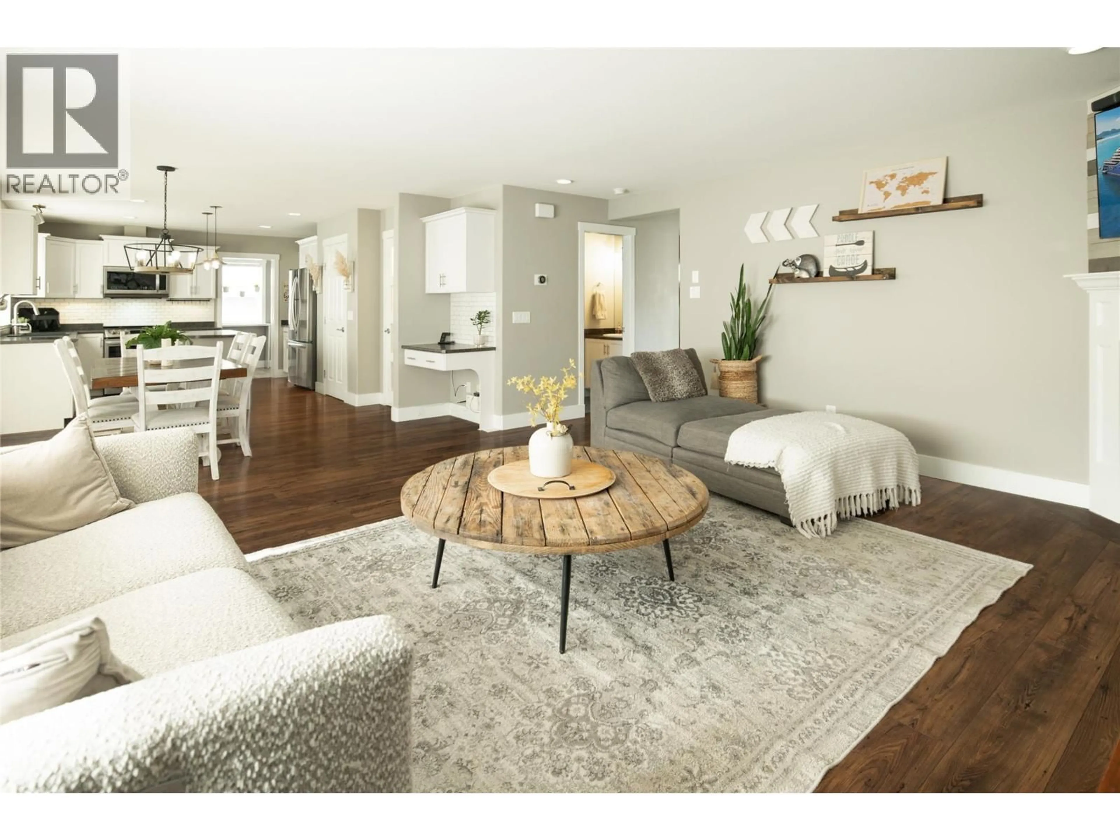 Living room with furniture, wood/laminate floor for 10460 SHERMAN DRIVE, Lake Country British Columbia V4V2N2