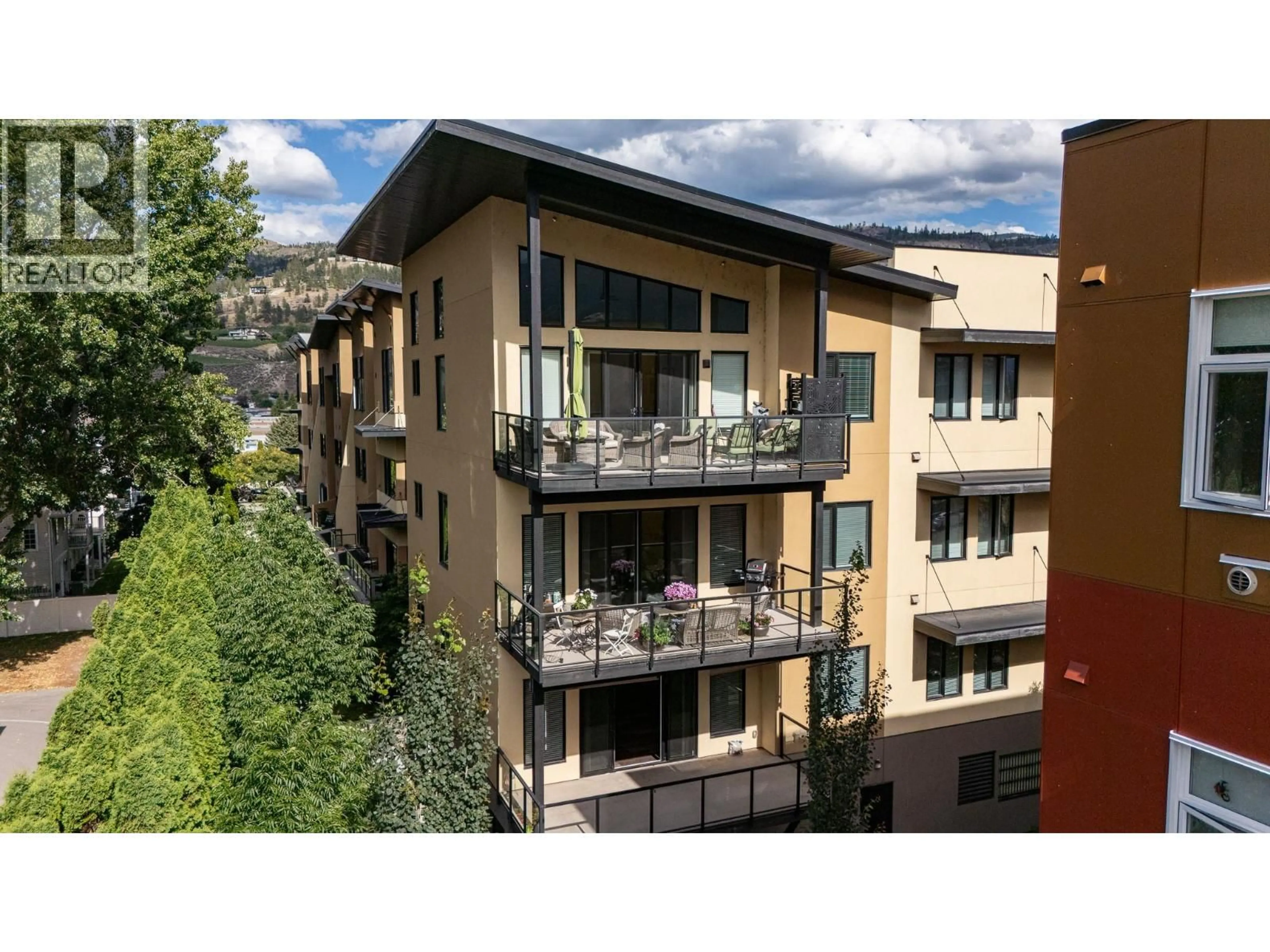 Balcony in the apartment, city buildings view from balcony for 213 - 3311 WILSON STREET, Penticton British Columbia V2A8J3