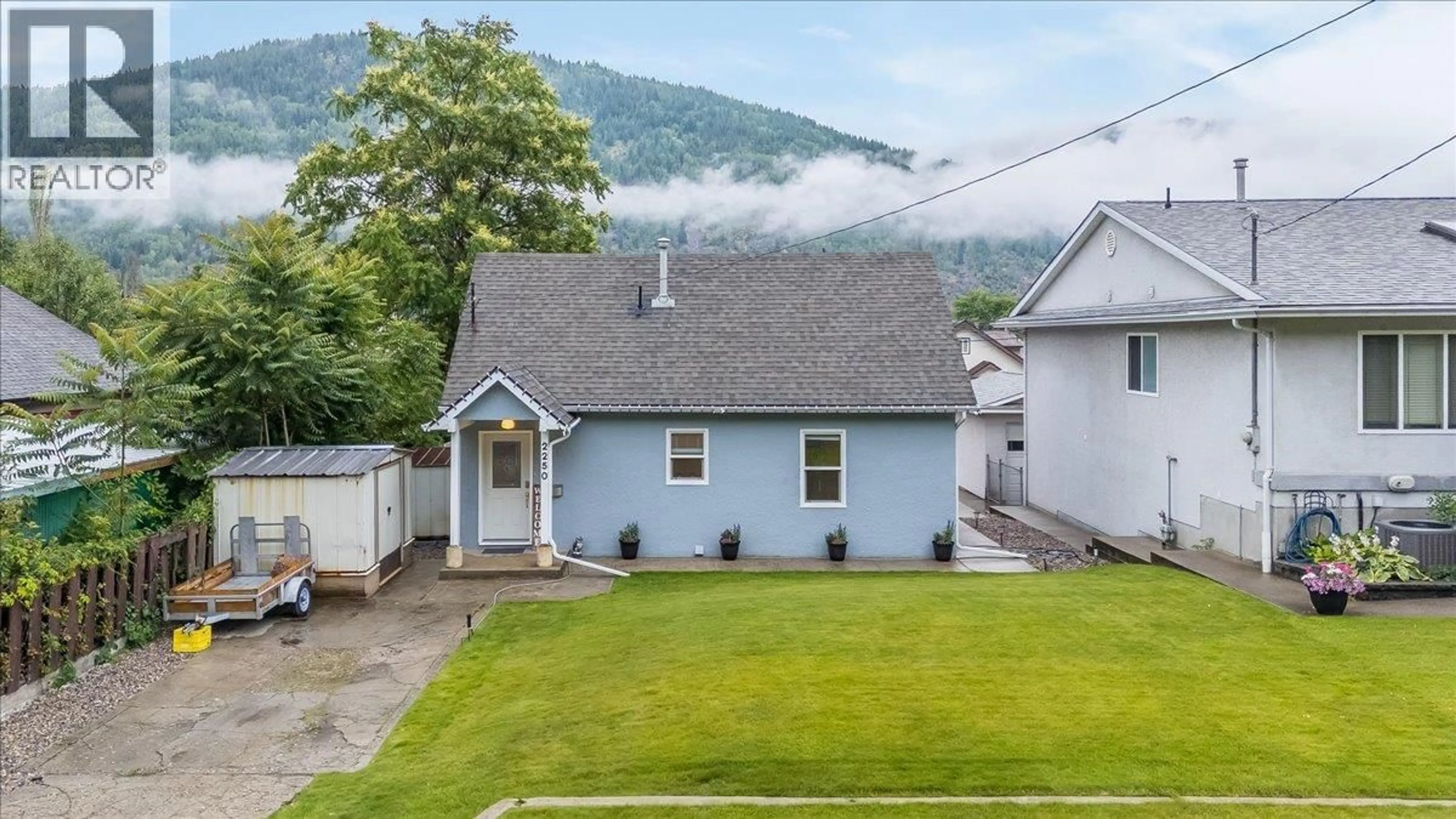 A pic from outside/outdoor area/front of a property/back of a property/a pic from drone, mountain view for 2250 EIGHTH AVENUE, Trail British Columbia V1R3E3
