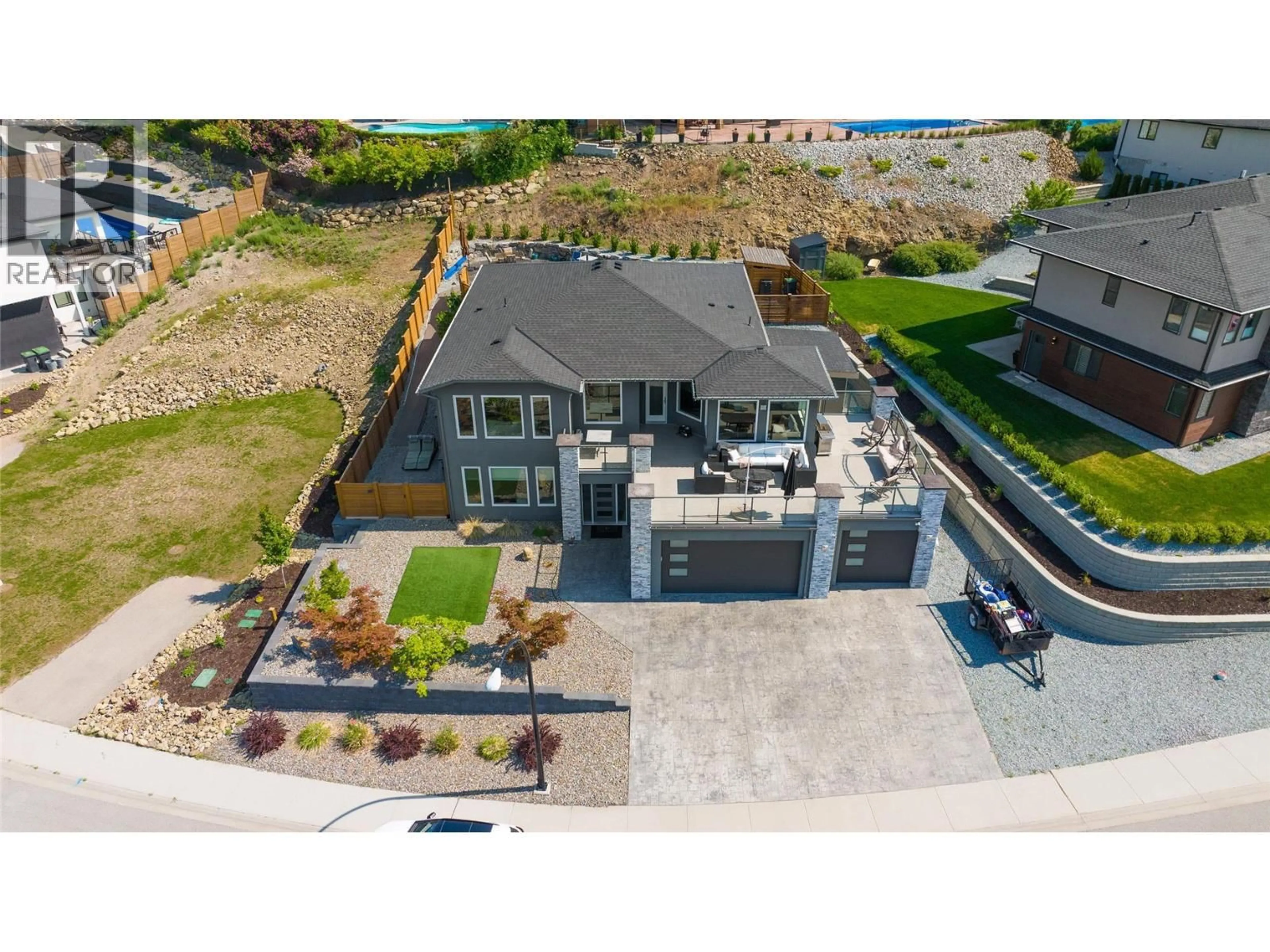 A pic from outside/outdoor area/front of a property/back of a property/a pic from drone, water/lake/river/ocean view for 3284 VINEYARD VIEW DRIVE, West Kelowna British Columbia V4T3B4