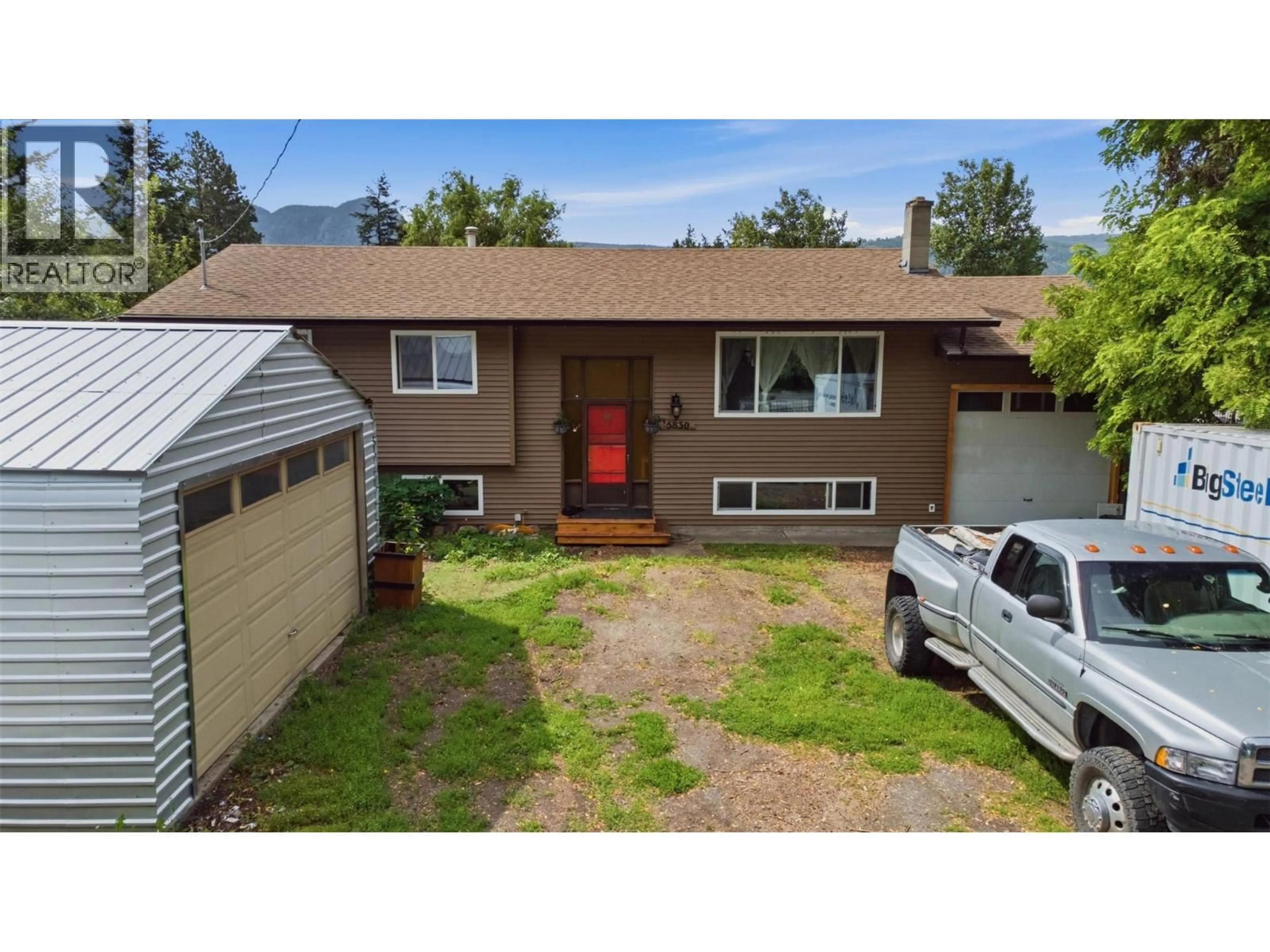 A pic from outside/outdoor area/front of a property/back of a property/a pic from drone, mountain view for 5830 6 HIGHWAY, Lavington British Columbia V1B3E1