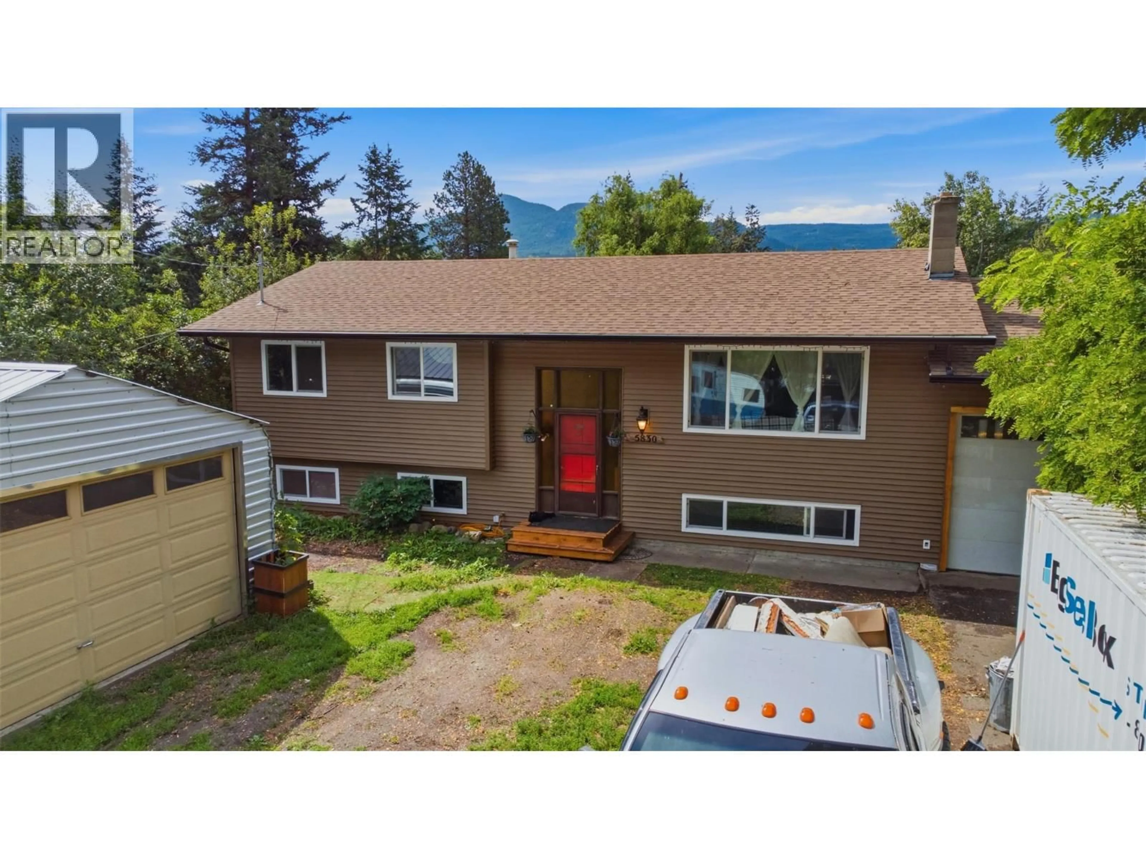 A pic from outside/outdoor area/front of a property/back of a property/a pic from drone, mountain view for 5830 6 HIGHWAY, Lavington British Columbia V1B3E1