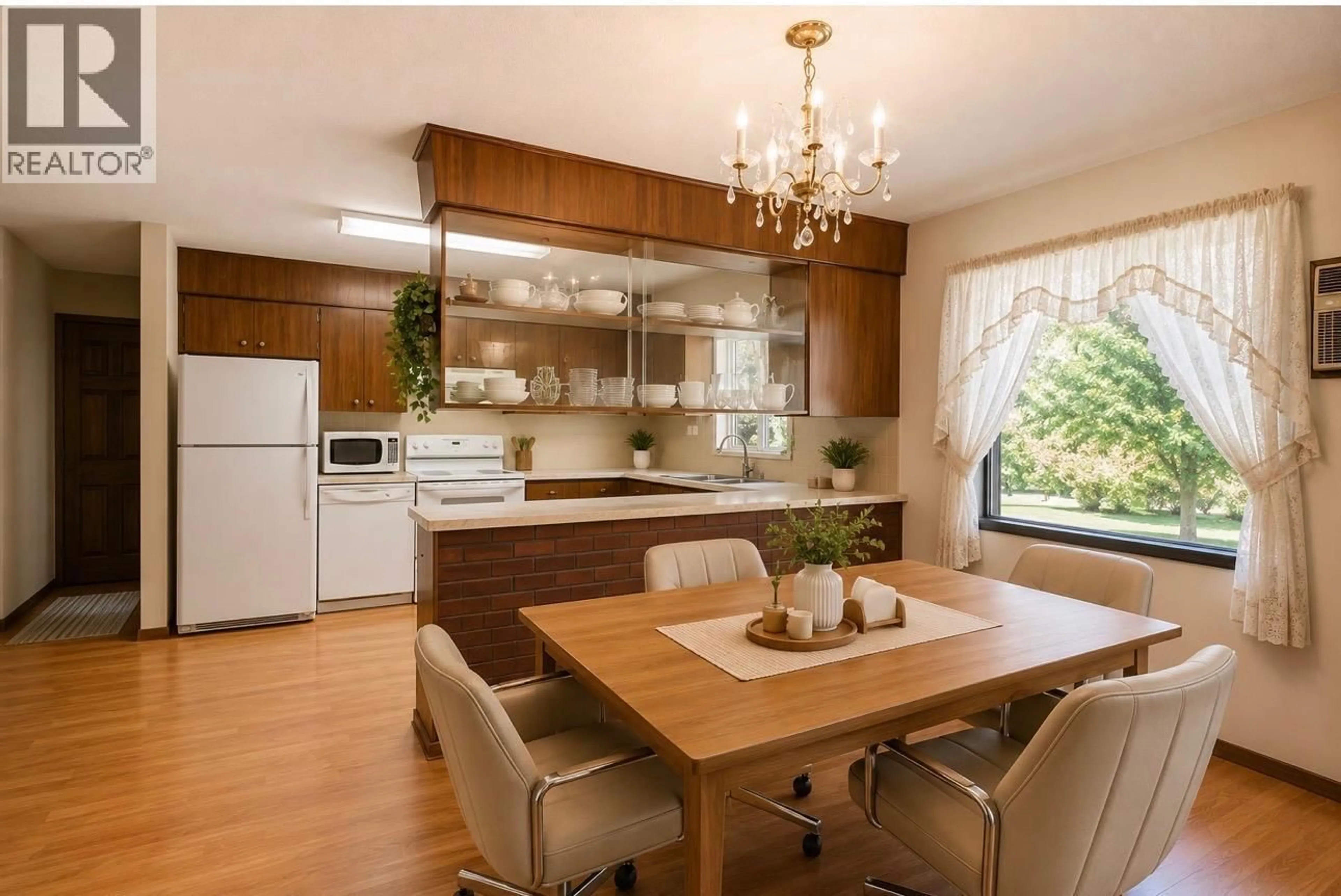 Open concept kitchen, wood/laminate floor for 807 WATERLOO ROAD, Ootischenia British Columbia V1N4K8