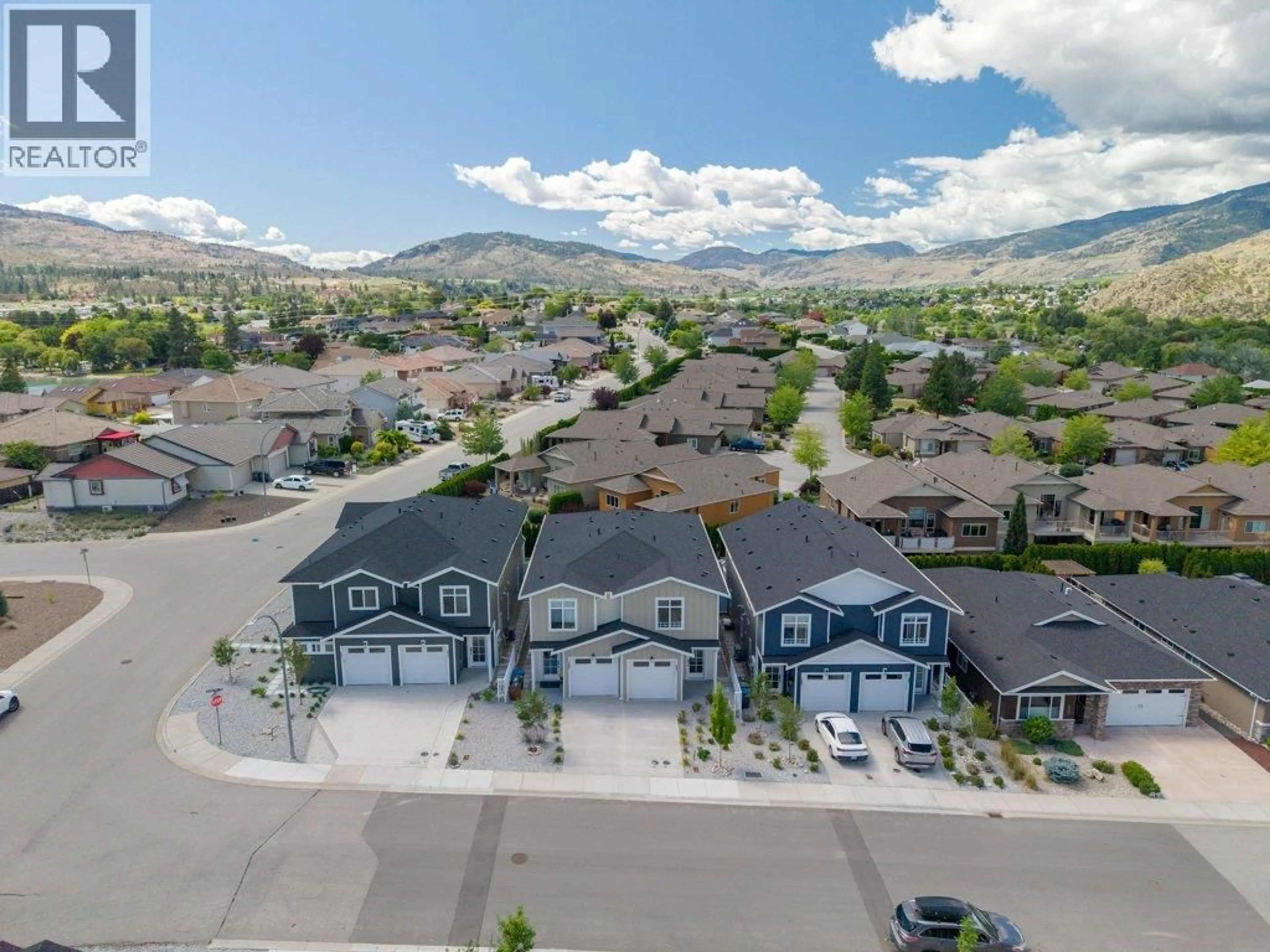A pic from outside/outdoor area/front of a property/back of a property/a pic from drone, mountain view for 387 CHARDONNAY AVENUE, Oliver British Columbia V0H1T4