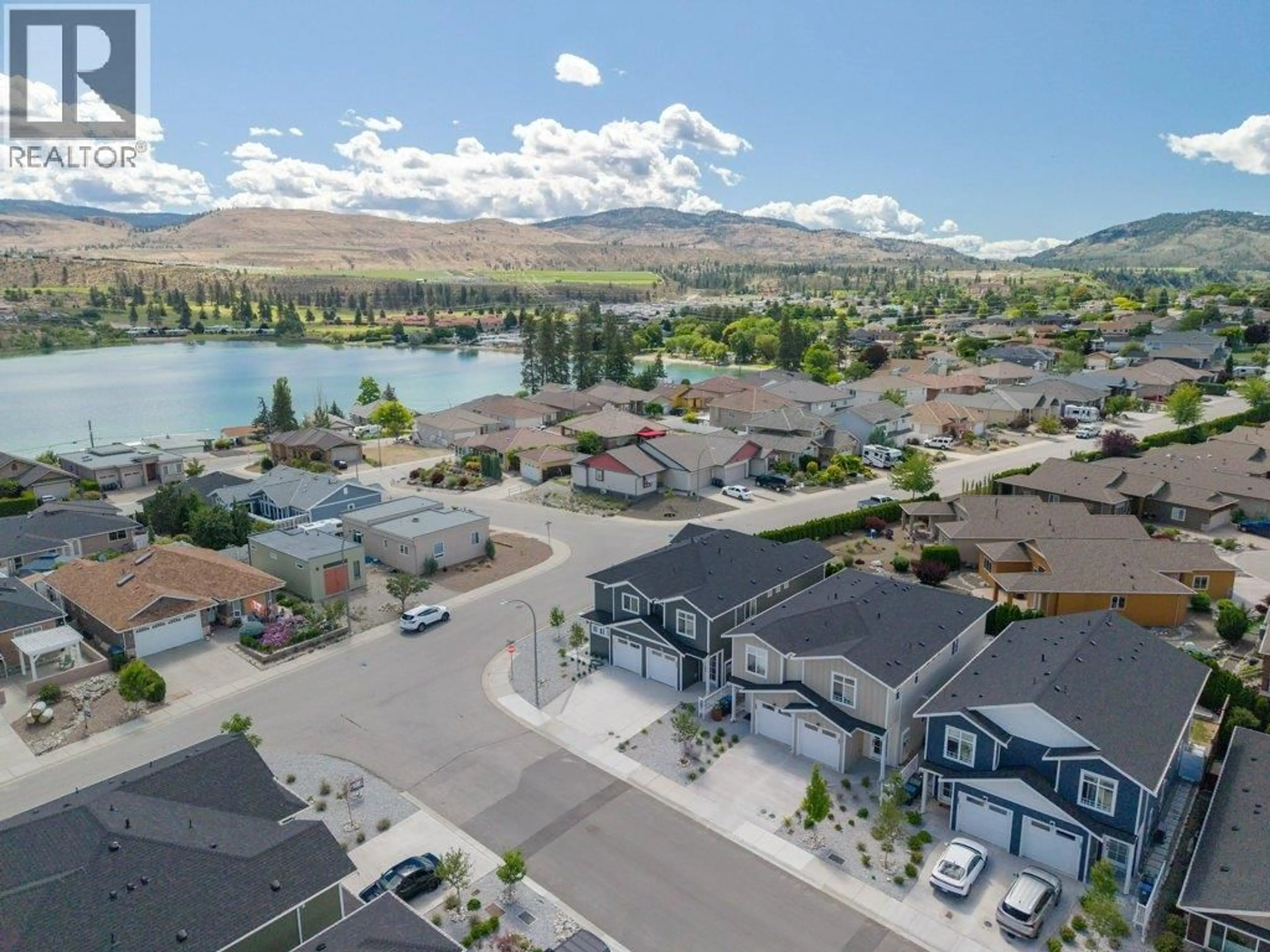 A pic from outside/outdoor area/front of a property/back of a property/a pic from drone, water/lake/river/ocean view for 387 CHARDONNAY AVENUE, Oliver British Columbia V0H1T4