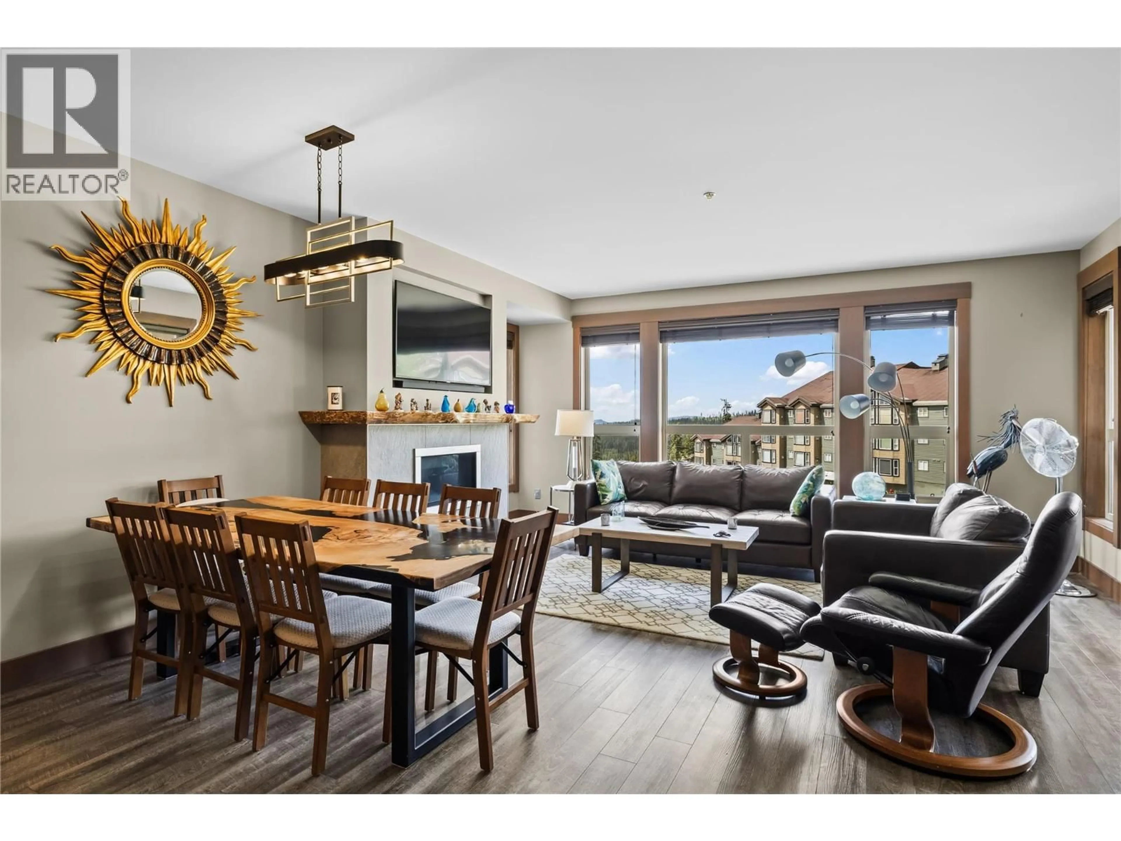 Living room with furniture, wood/laminate floor for 203 - 5300B BIG WHITE ROAD, Big White British Columbia V1P1P3