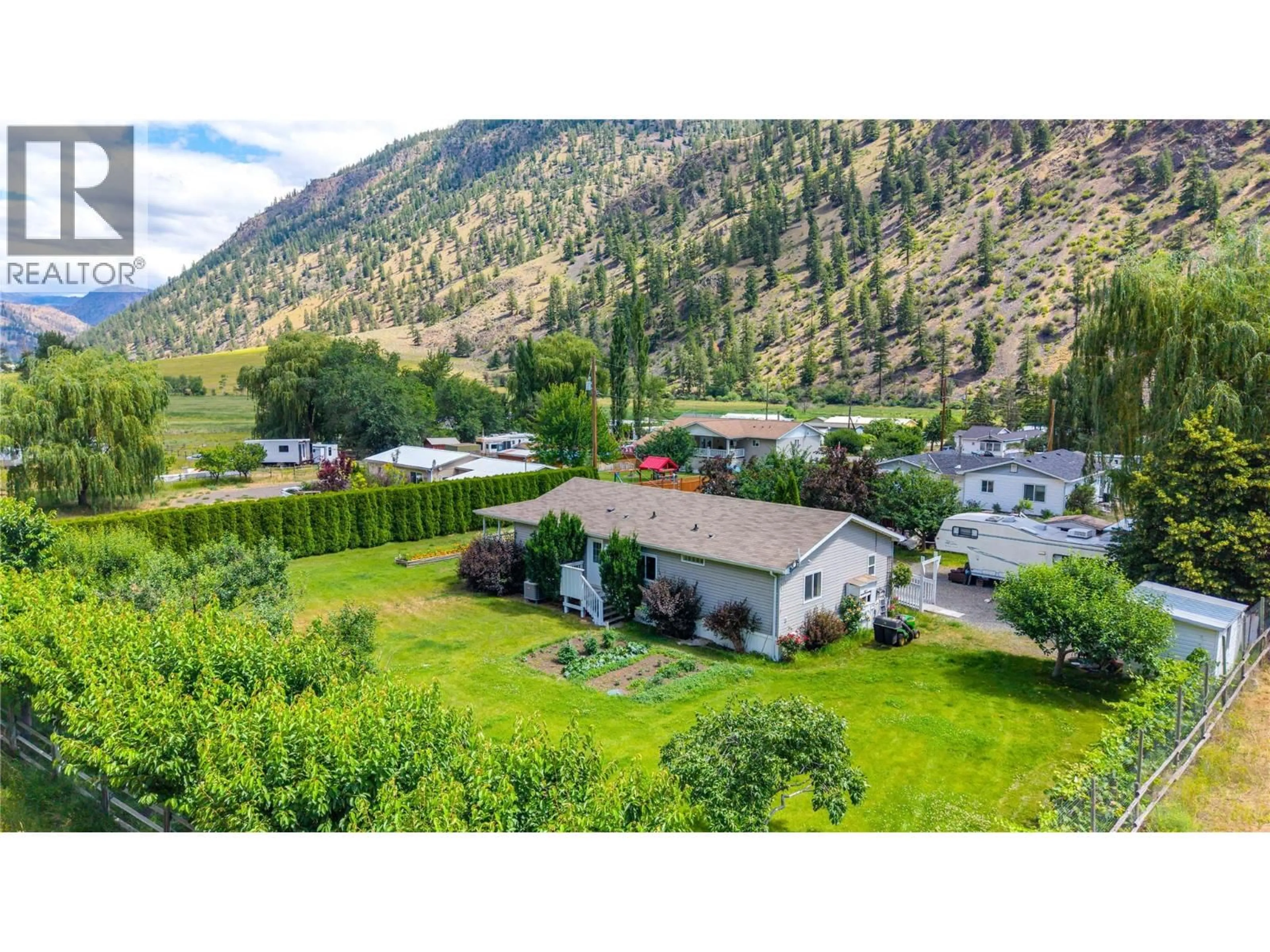A pic from outside/outdoor area/front of a property/back of a property/a pic from drone, mountain view for 1526 MAIN STREET NORTH, Olalla British Columbia V0X1N6