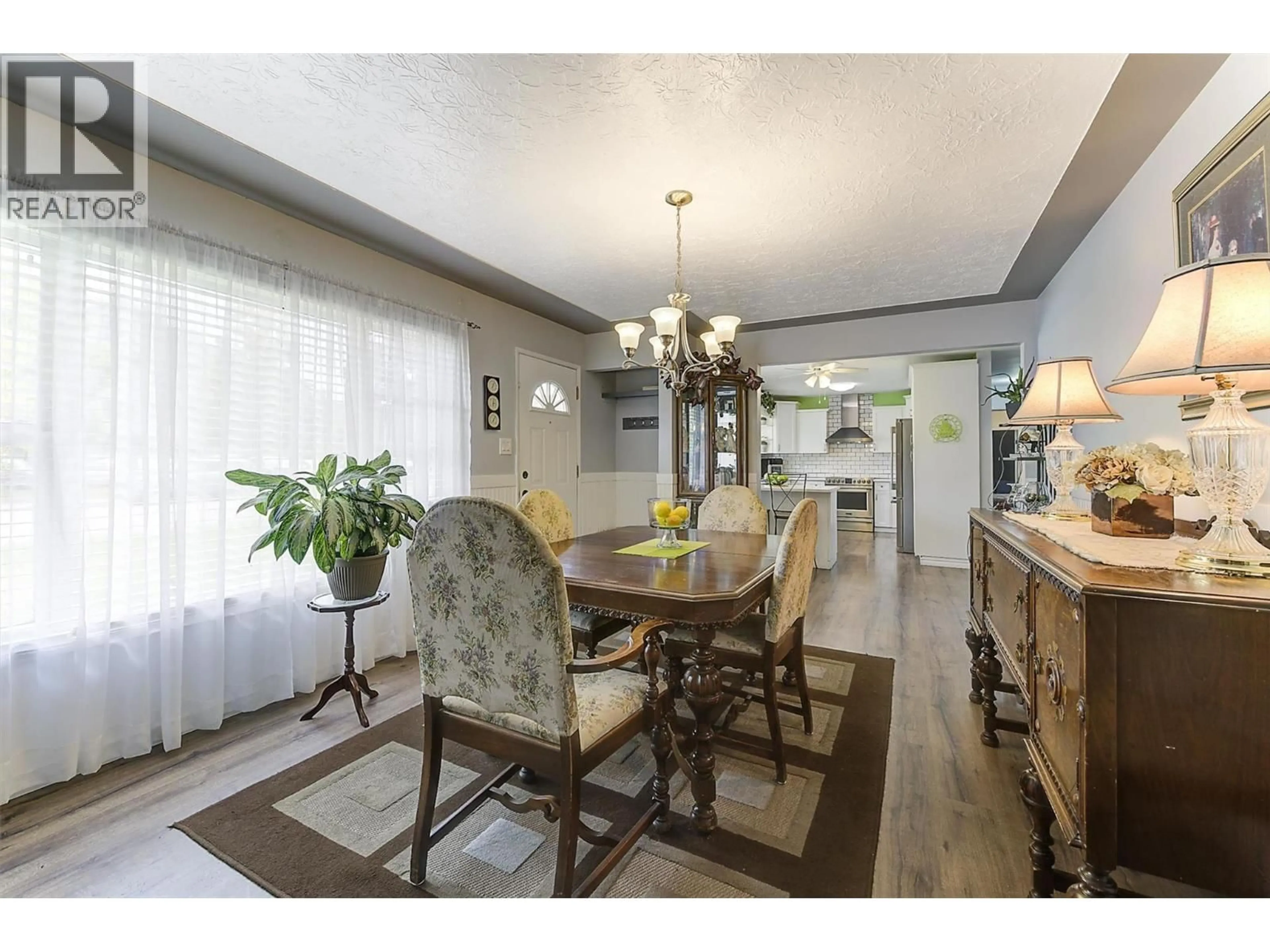 Dining room, wood/laminate floor for 650 FORD ROAD, Kelowna British Columbia V1X3E1