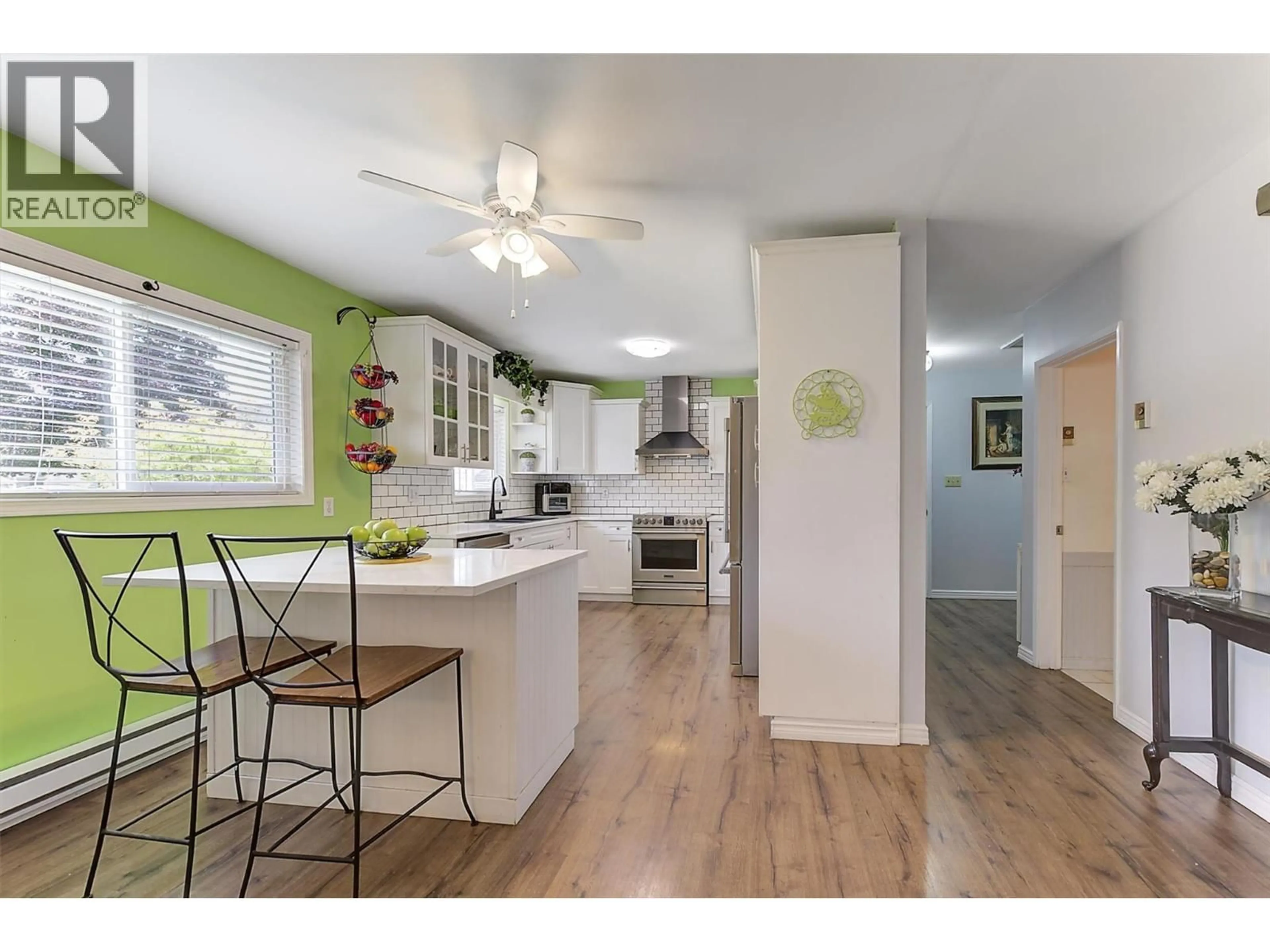 Open concept kitchen, wood/laminate floor for 650 FORD ROAD, Kelowna British Columbia V1X3E1