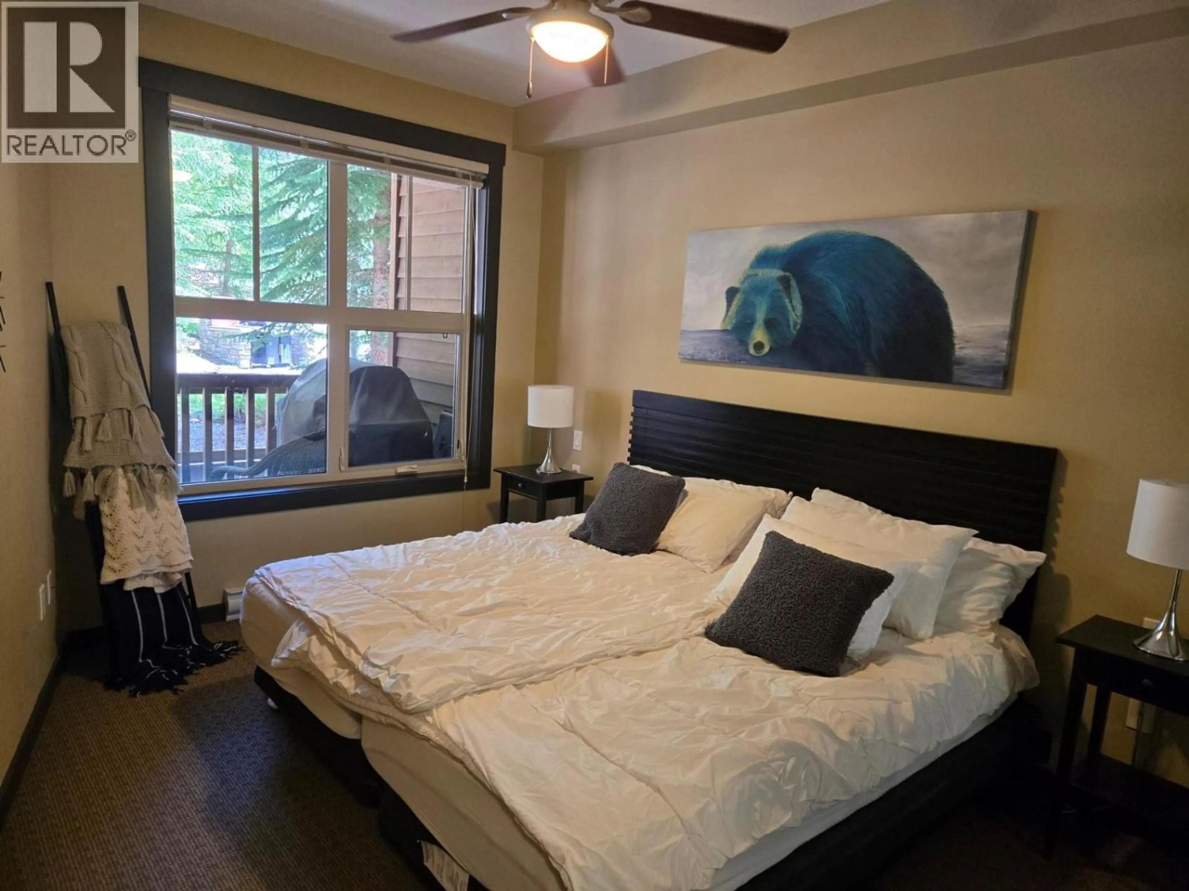 Bedroom with bed, wood/laminate floor for 109 - 2064 SUMMIT DRIVE, Panorama British Columbia V0A1T0