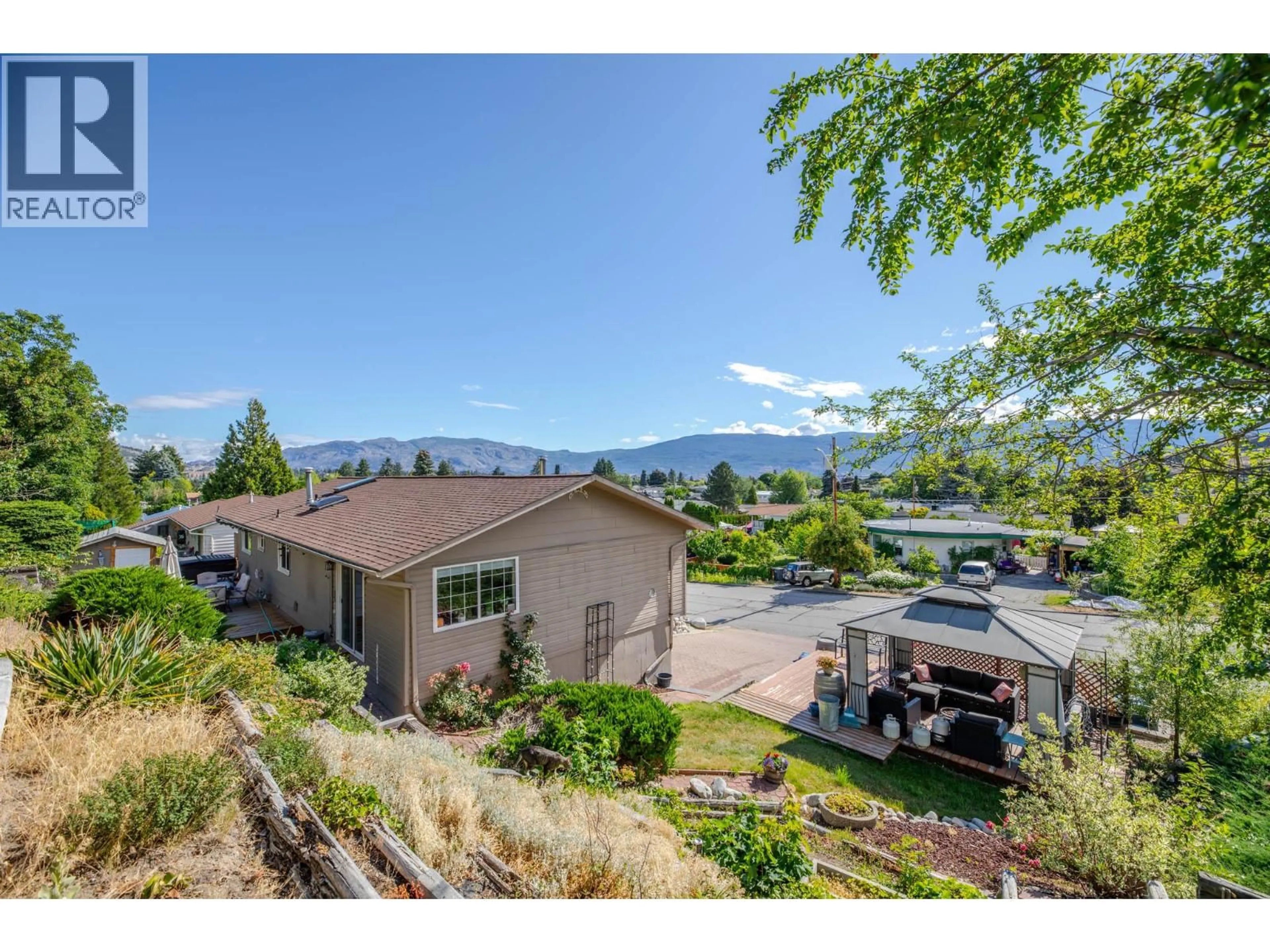 A pic from outside/outdoor area/front of a property/back of a property/a pic from drone, mountain view for 12620 REYNOLDS AVENUE, Summerland British Columbia V0H1Z8