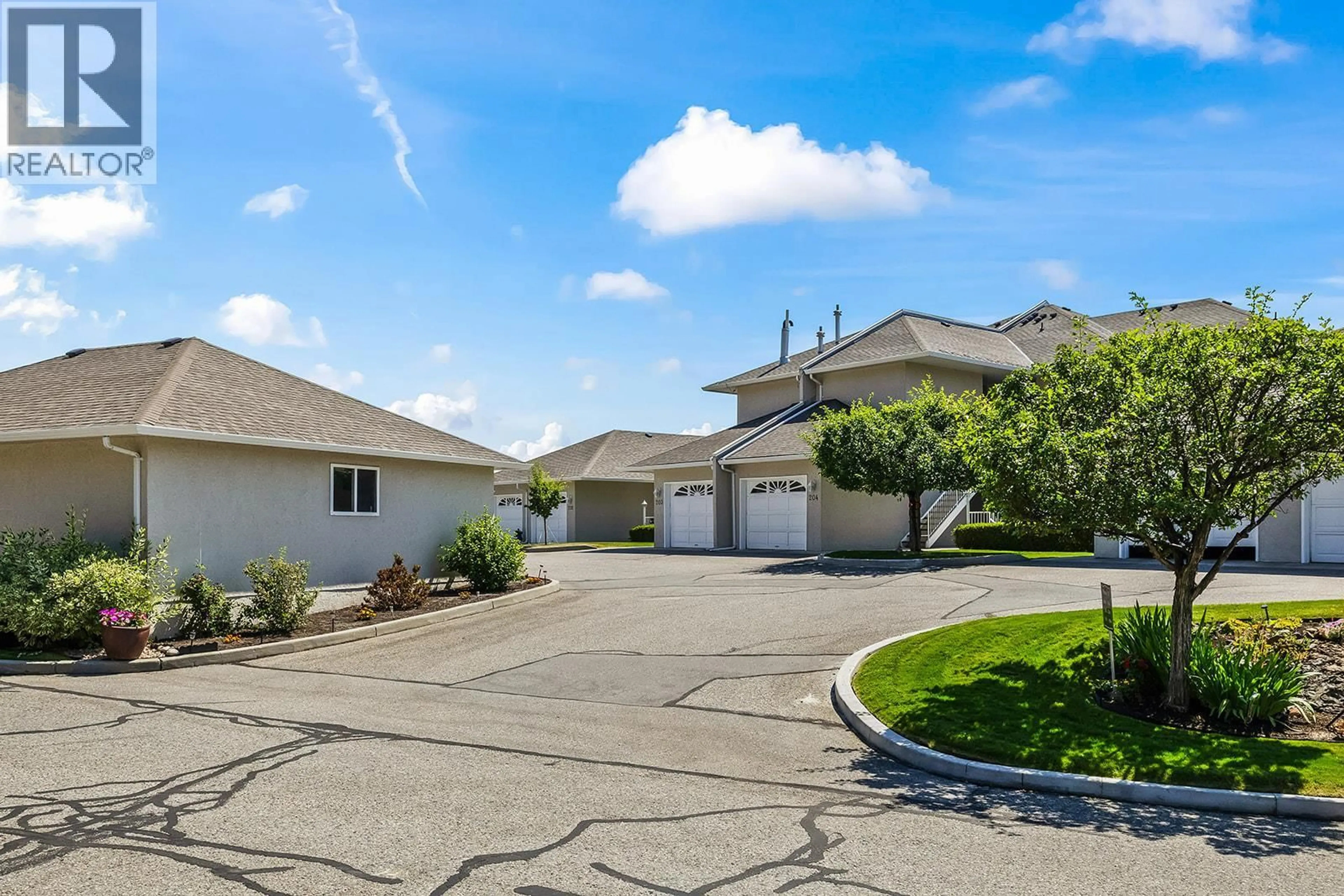 A pic from outside/outdoor area/front of a property/back of a property/a pic from drone, street for 201 - 2377 SHANNON WOODS DRIVE, West Kelowna British Columbia V4T2L8