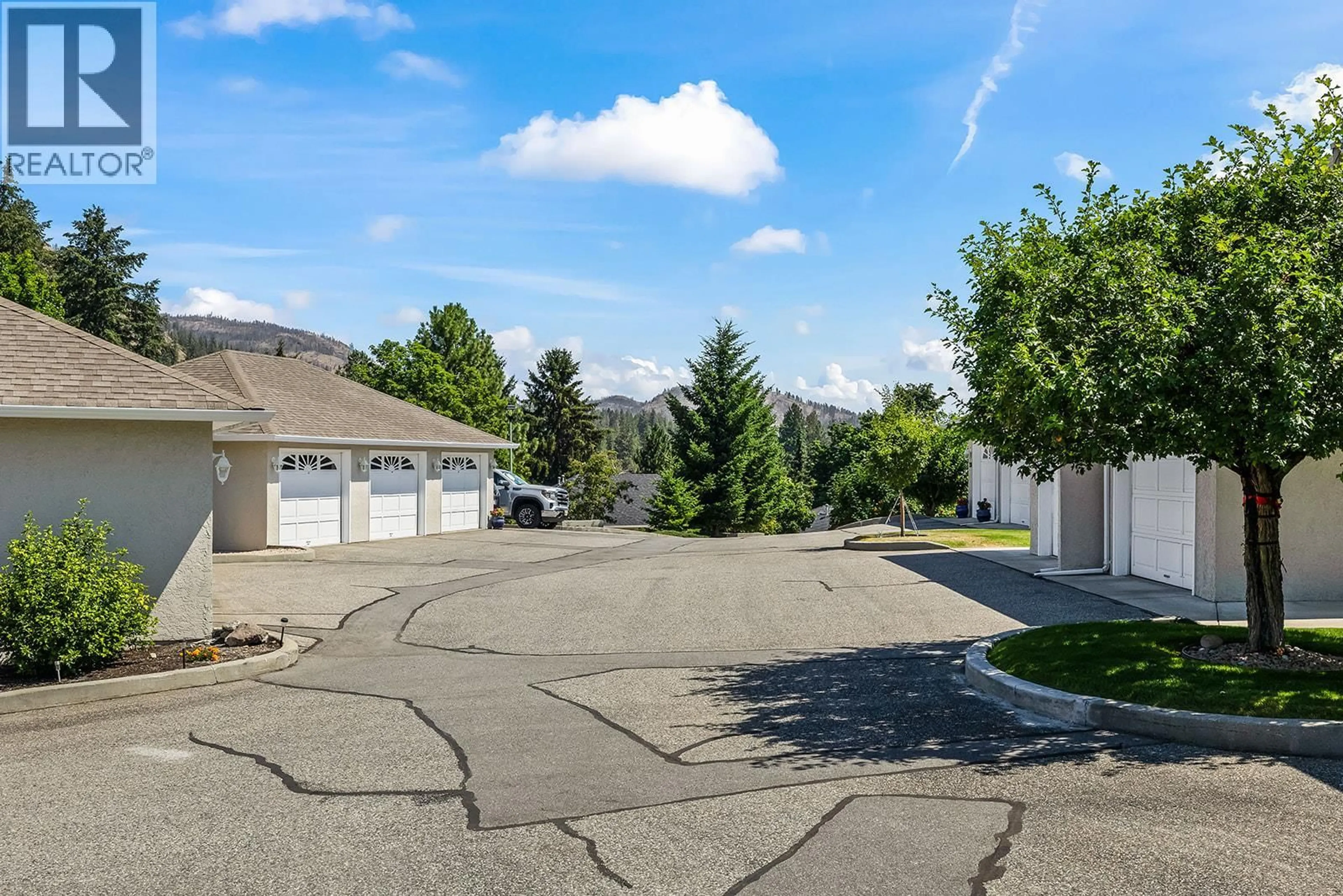 A pic from outside/outdoor area/front of a property/back of a property/a pic from drone, street for 201 - 2377 SHANNON WOODS DRIVE, West Kelowna British Columbia V4T2L8