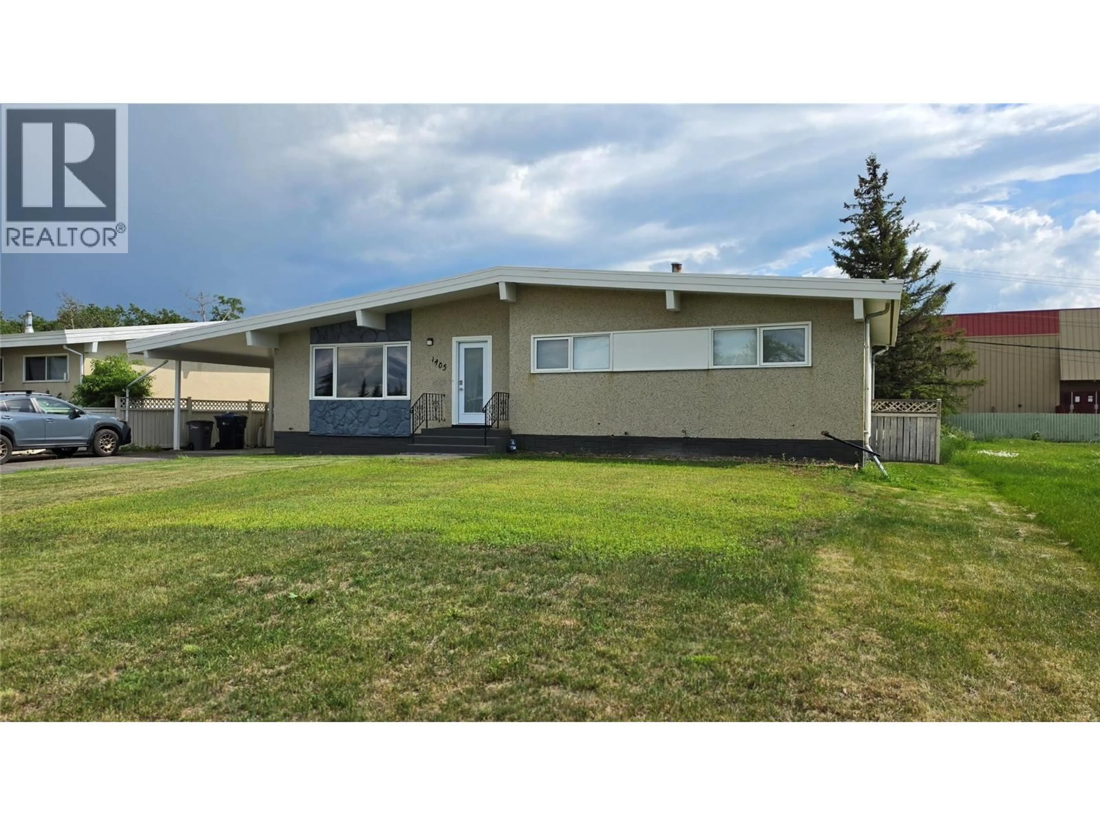 Home with vinyl exterior material, street for 1405 108 AVENUE, Dawson Creek British Columbia V1G2T2