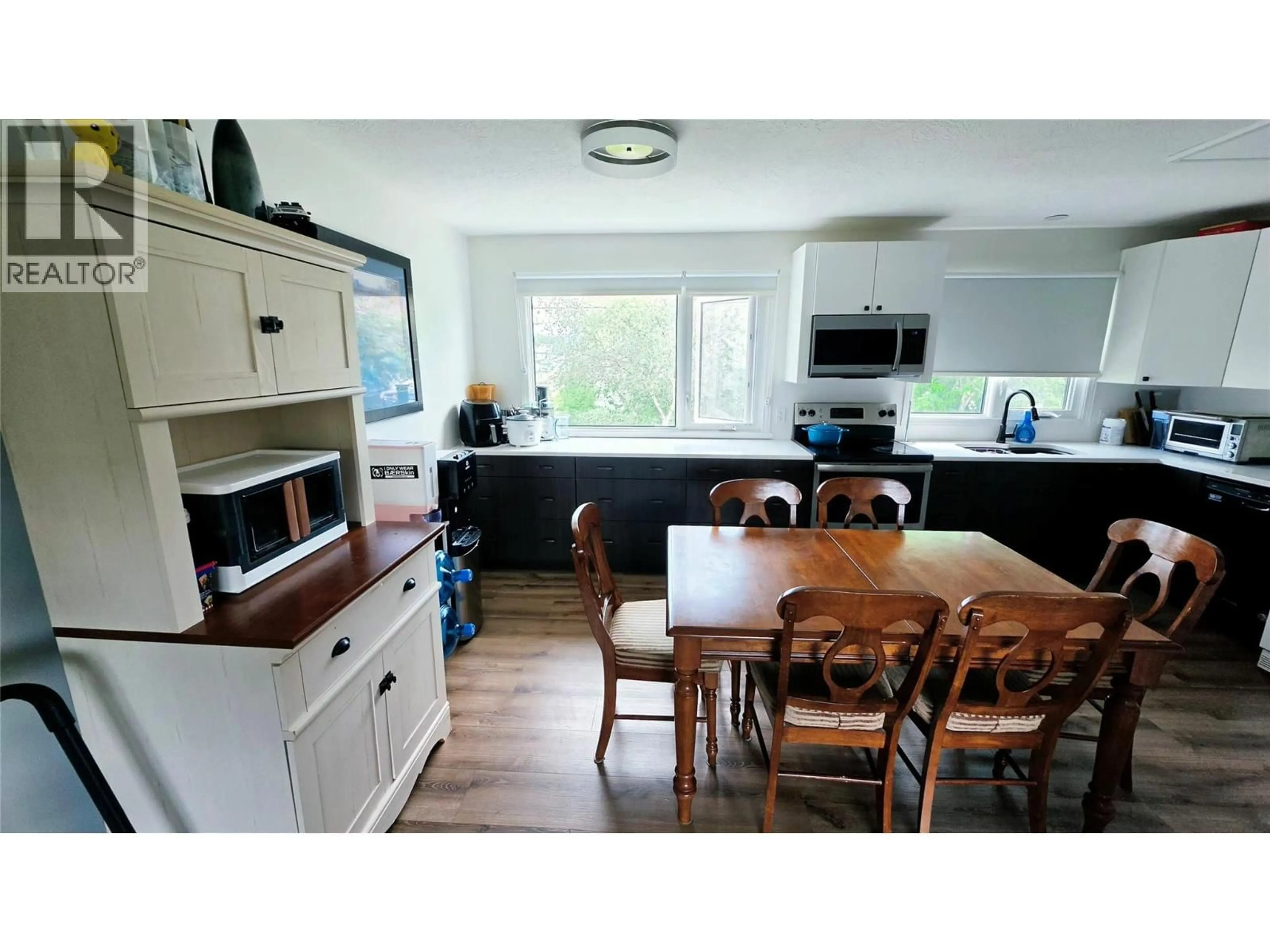Open concept kitchen, wood/laminate floor for 1405 108 AVENUE, Dawson Creek British Columbia V1G2T2
