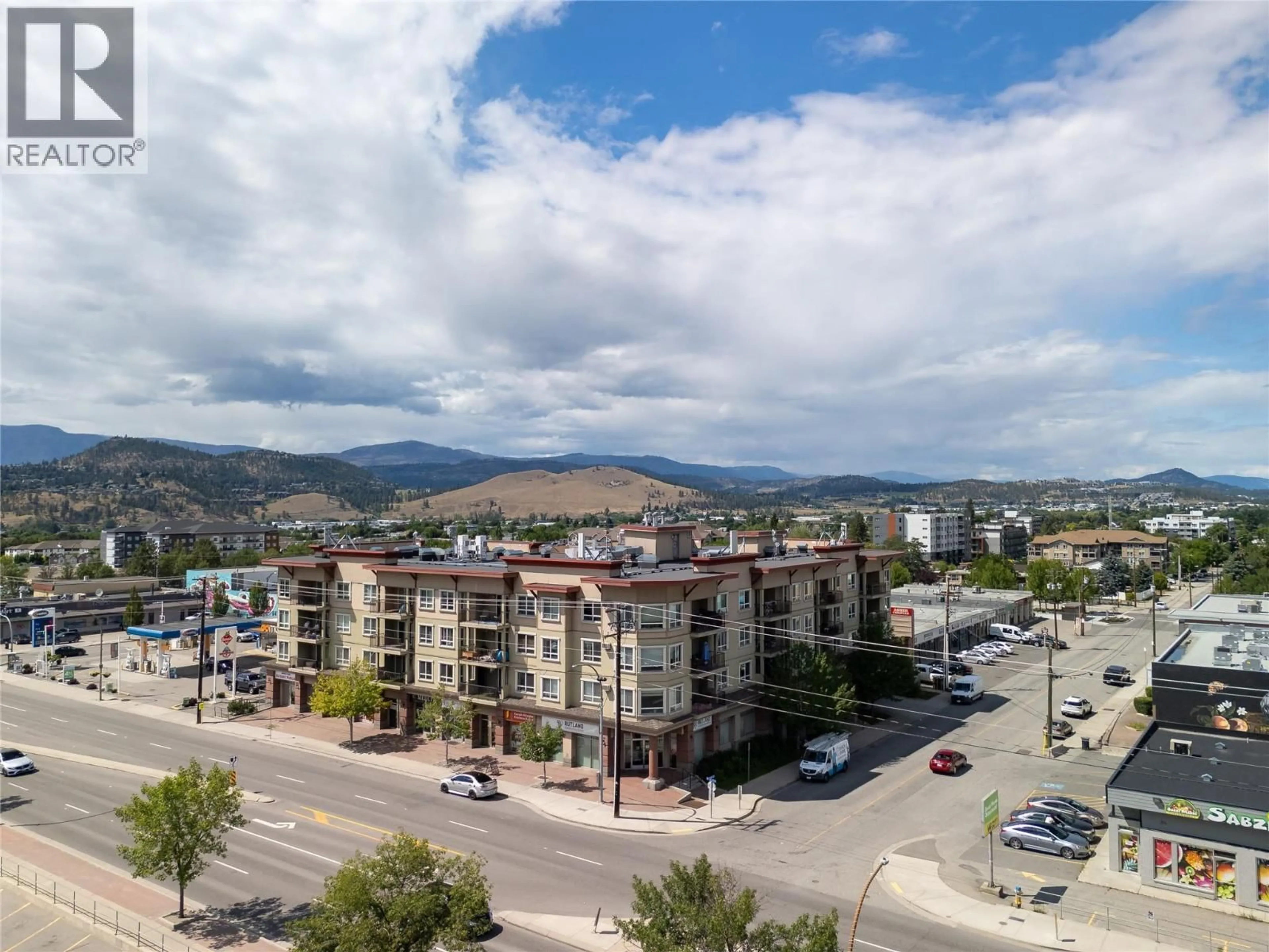A pic from outside/outdoor area/front of a property/back of a property/a pic from drone, mountain view for 205 - 140 ASHER ROAD, Kelowna British Columbia V1X3H6