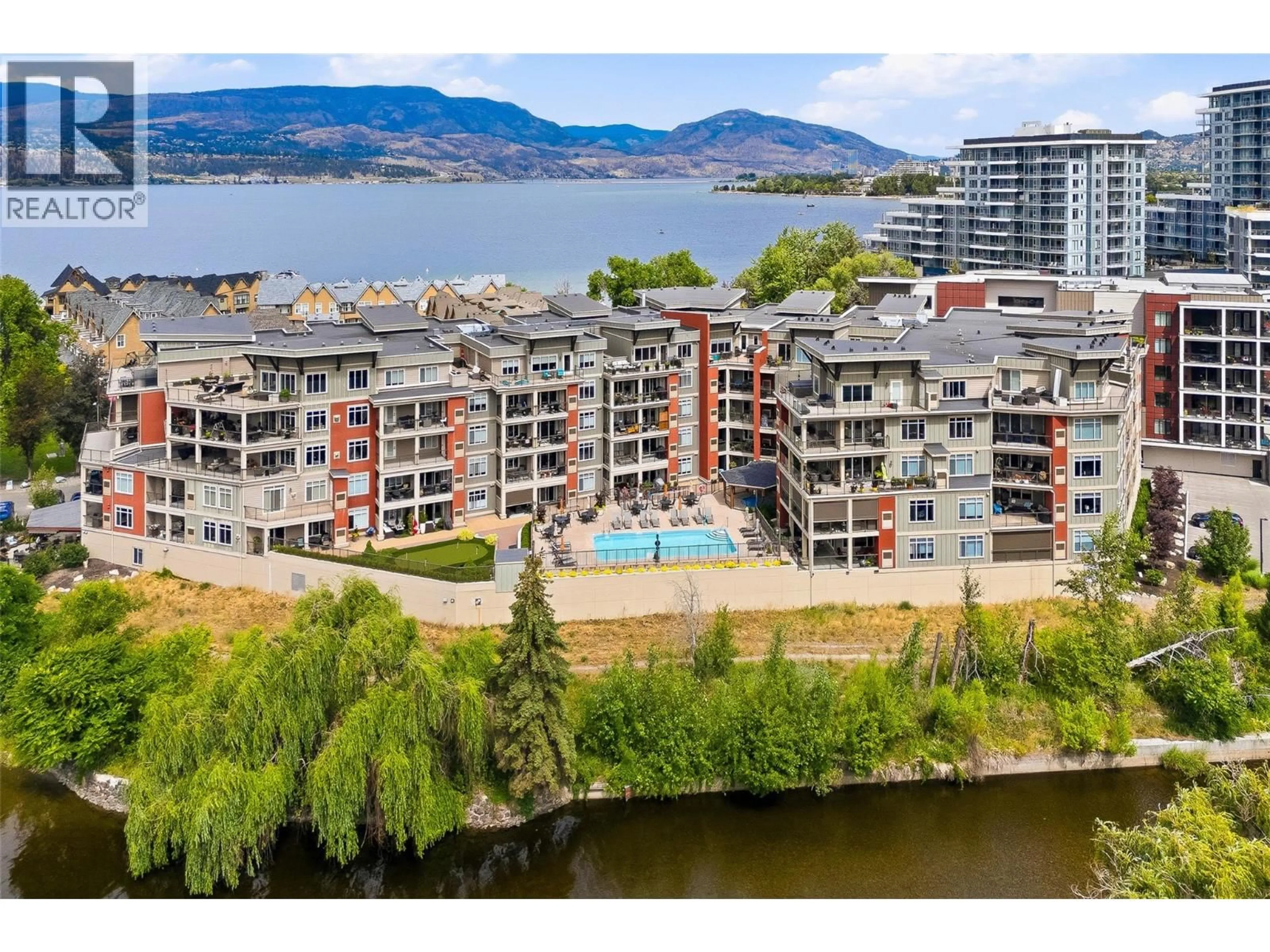 A pic from outside/outdoor area/front of a property/back of a property/a pic from drone, water/lake/river/ocean view for 311 - 3865 TRUSWELL ROAD, Kelowna British Columbia V1W3K9
