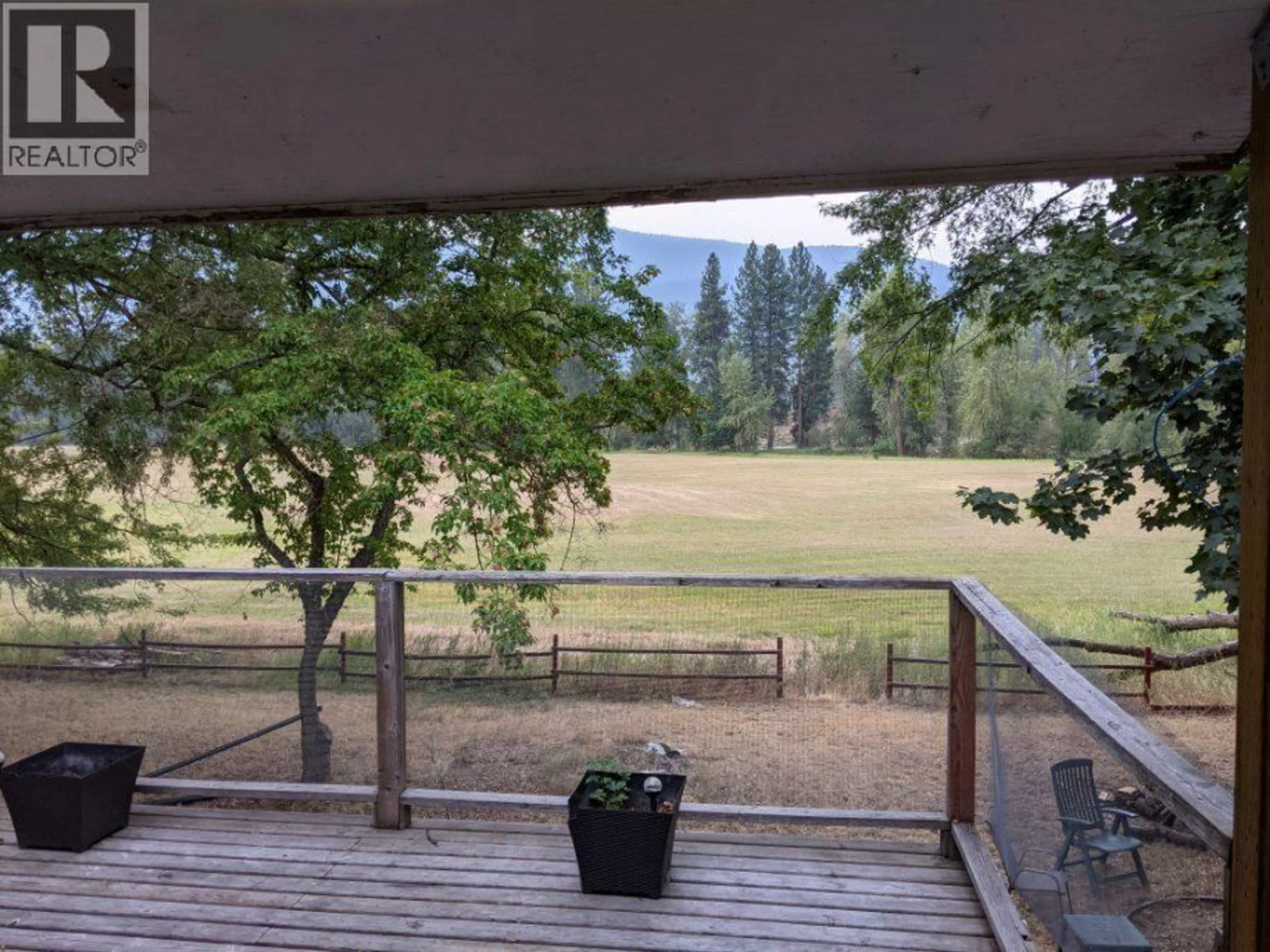 A pic from outside/outdoor area/front of a property/back of a property/a pic from drone, forest/trees view for 6465 27 STREET, Grand Forks British Columbia V0H1H0