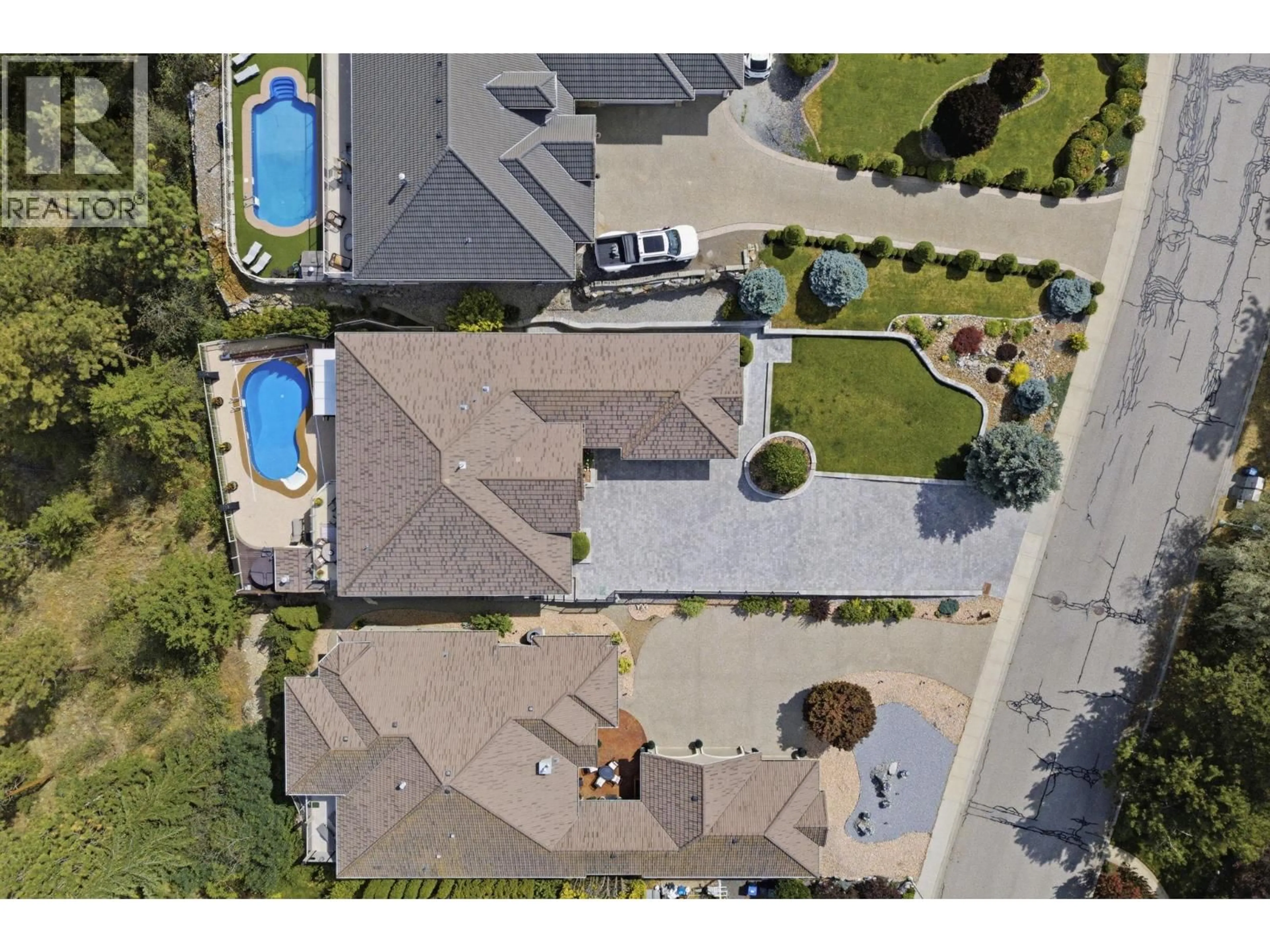 A pic from outside/outdoor area/front of a property/back of a property/a pic from drone, street for 2109 CAPISTRANO DRIVE, Kelowna British Columbia V1V2N1