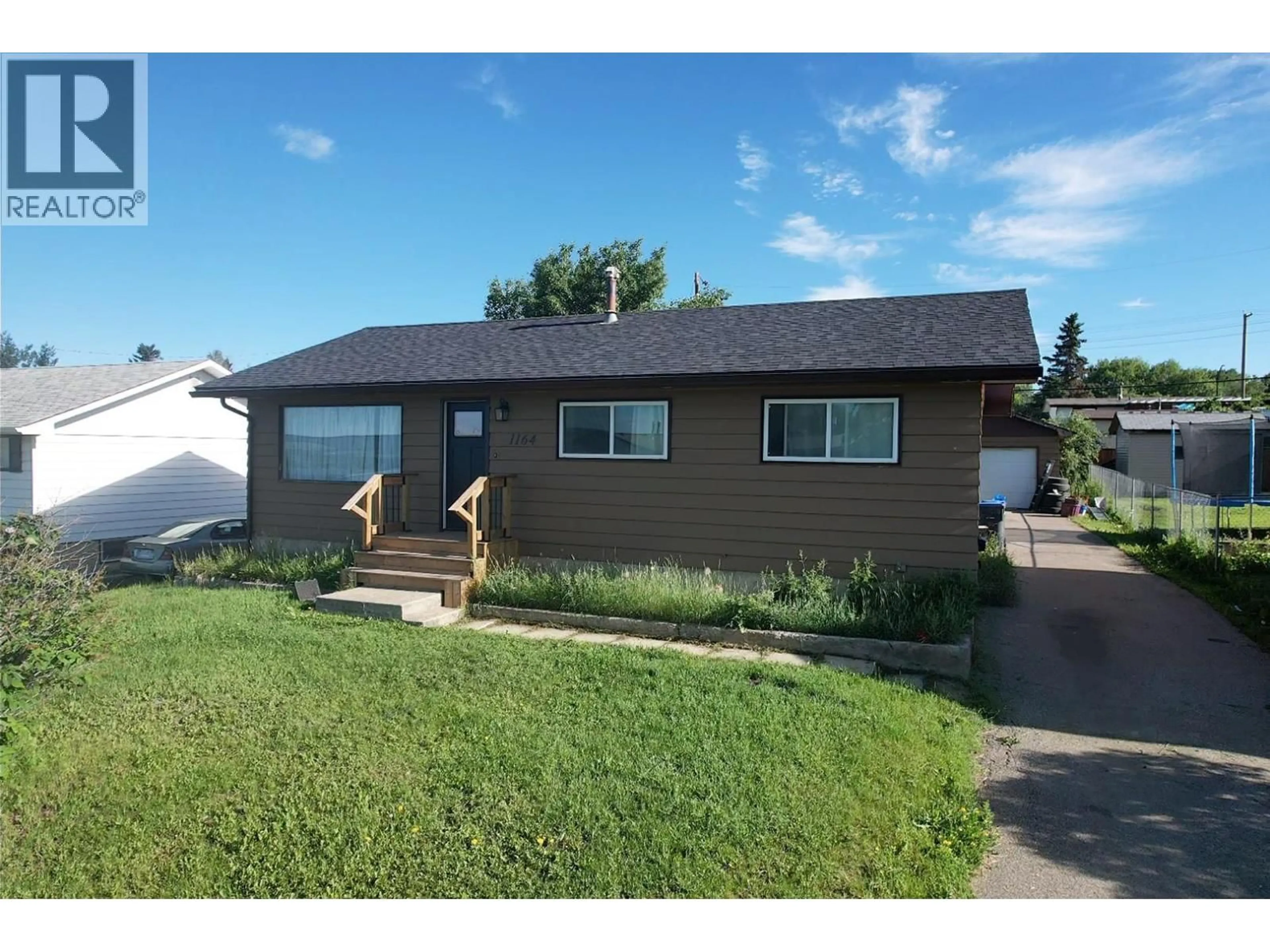 Home with vinyl exterior material, street for 1164 96A AVENUE, Dawson Creek British Columbia V1G1M8