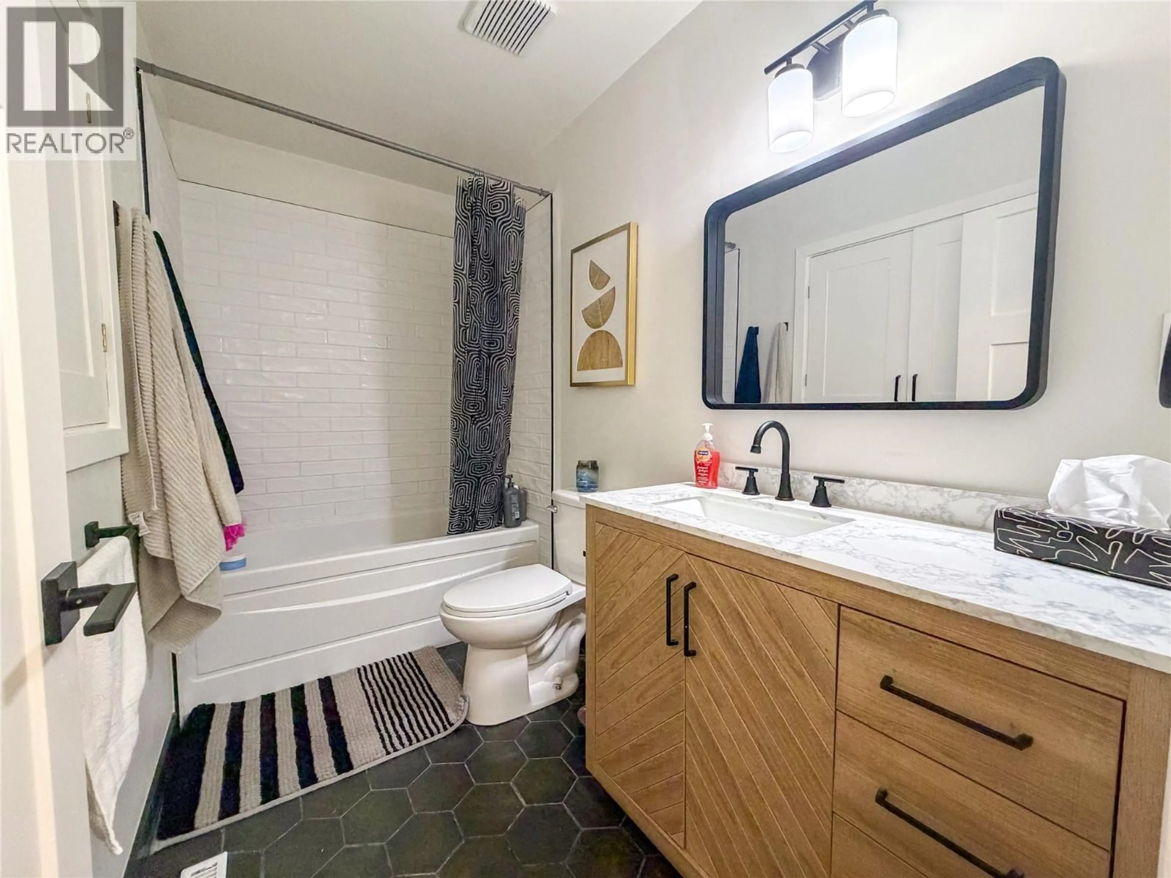 Standard bathroom, ceramic/tile floor for 1164 96A AVENUE, Dawson Creek British Columbia V1G1M8