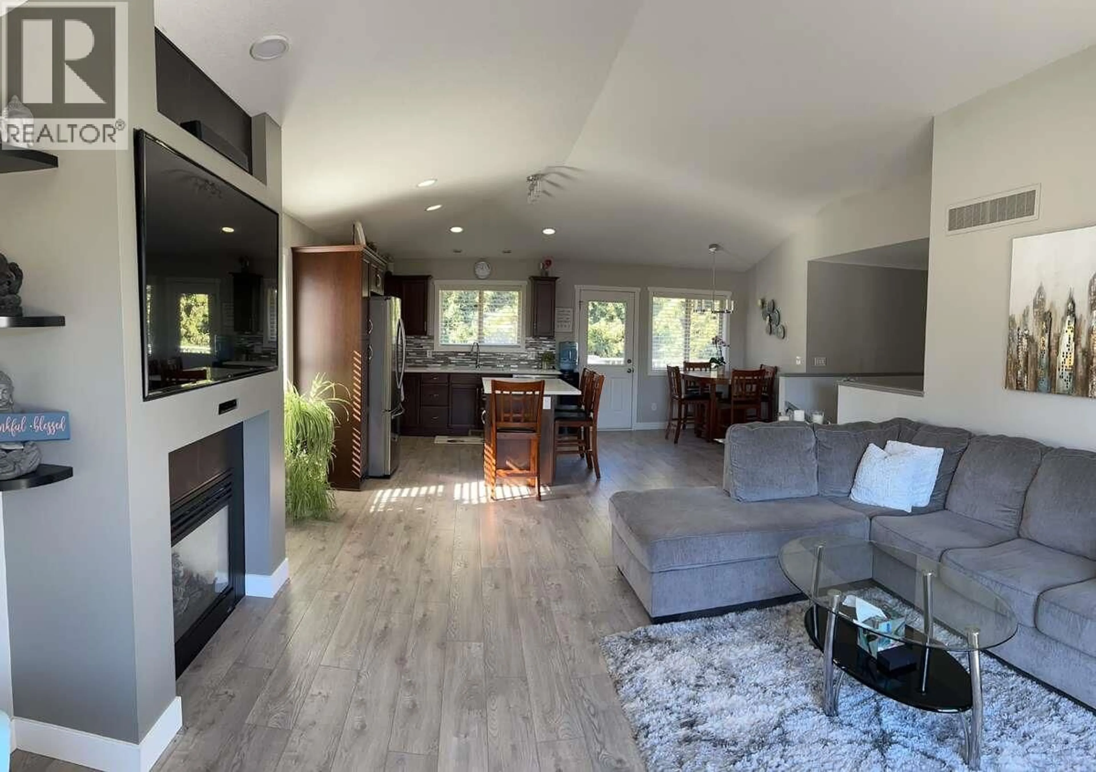 Living room with furniture, wood/laminate floor for 2906 BENTLEY ROAD, West Kelowna British Columbia V4T3B3