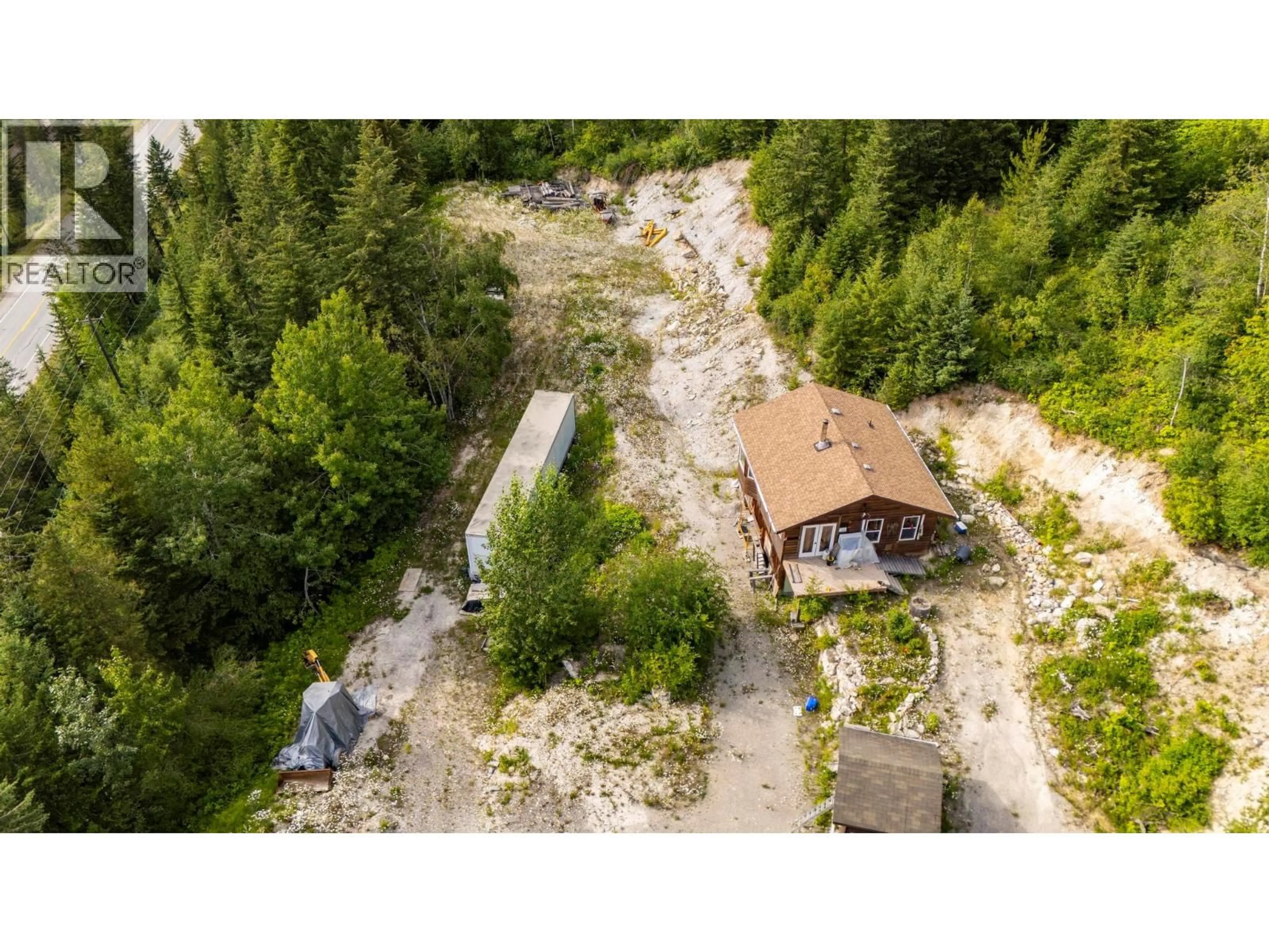 A pic from outside/outdoor area/front of a property/back of a property/a pic from drone, forest/trees view for 1664 TRANS CANADA N HIGHWAY, Golden British Columbia V0A1H0
