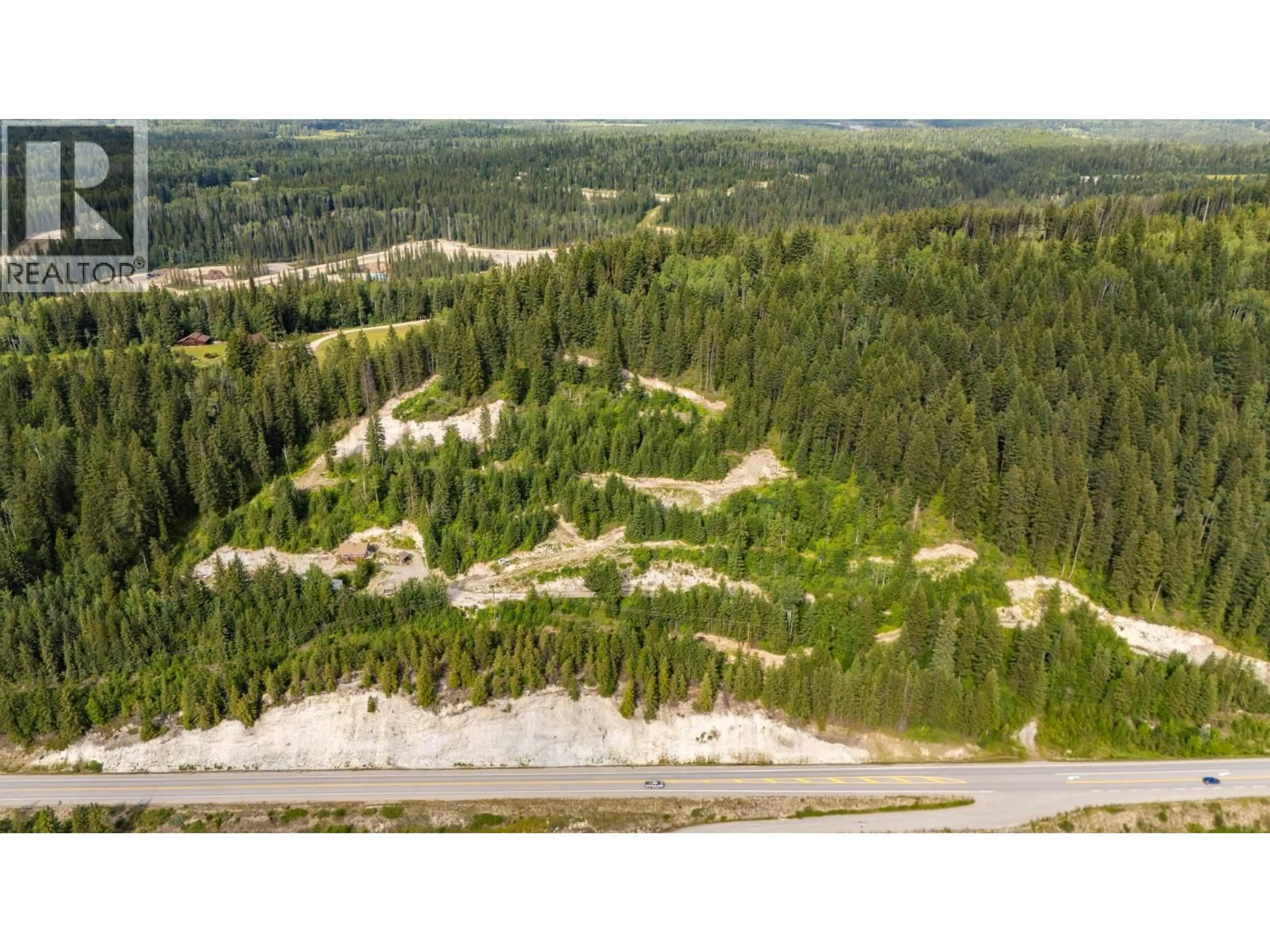 A pic from outside/outdoor area/front of a property/back of a property/a pic from drone, forest/trees view for 1664 TRANS CANADA N HIGHWAY, Golden British Columbia V0A1H0