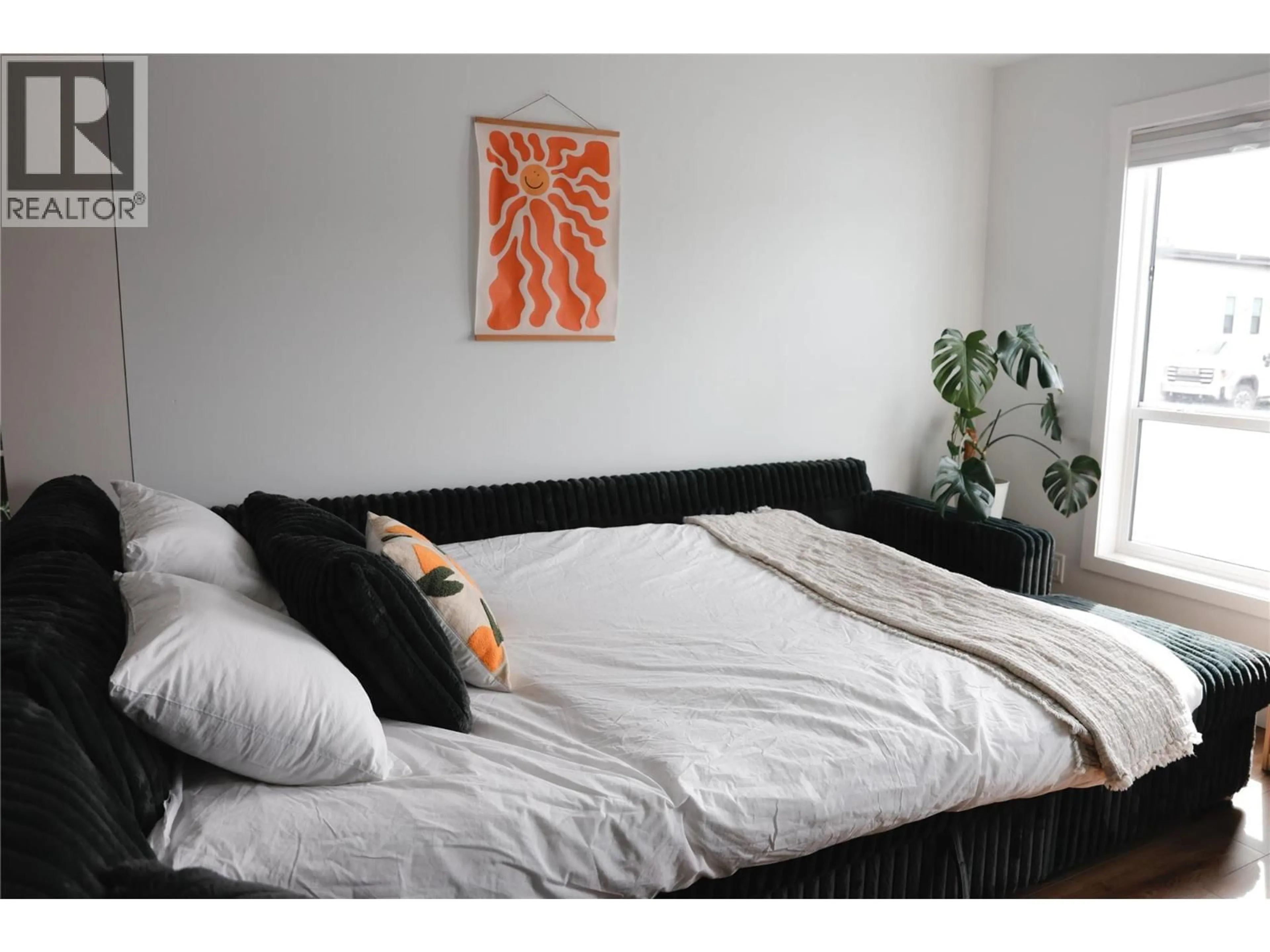Bedroom with bed, wood/laminate floor for 20 - 8900 JIM BAILEY ROAD, Kelowna British Columbia V4V0B5