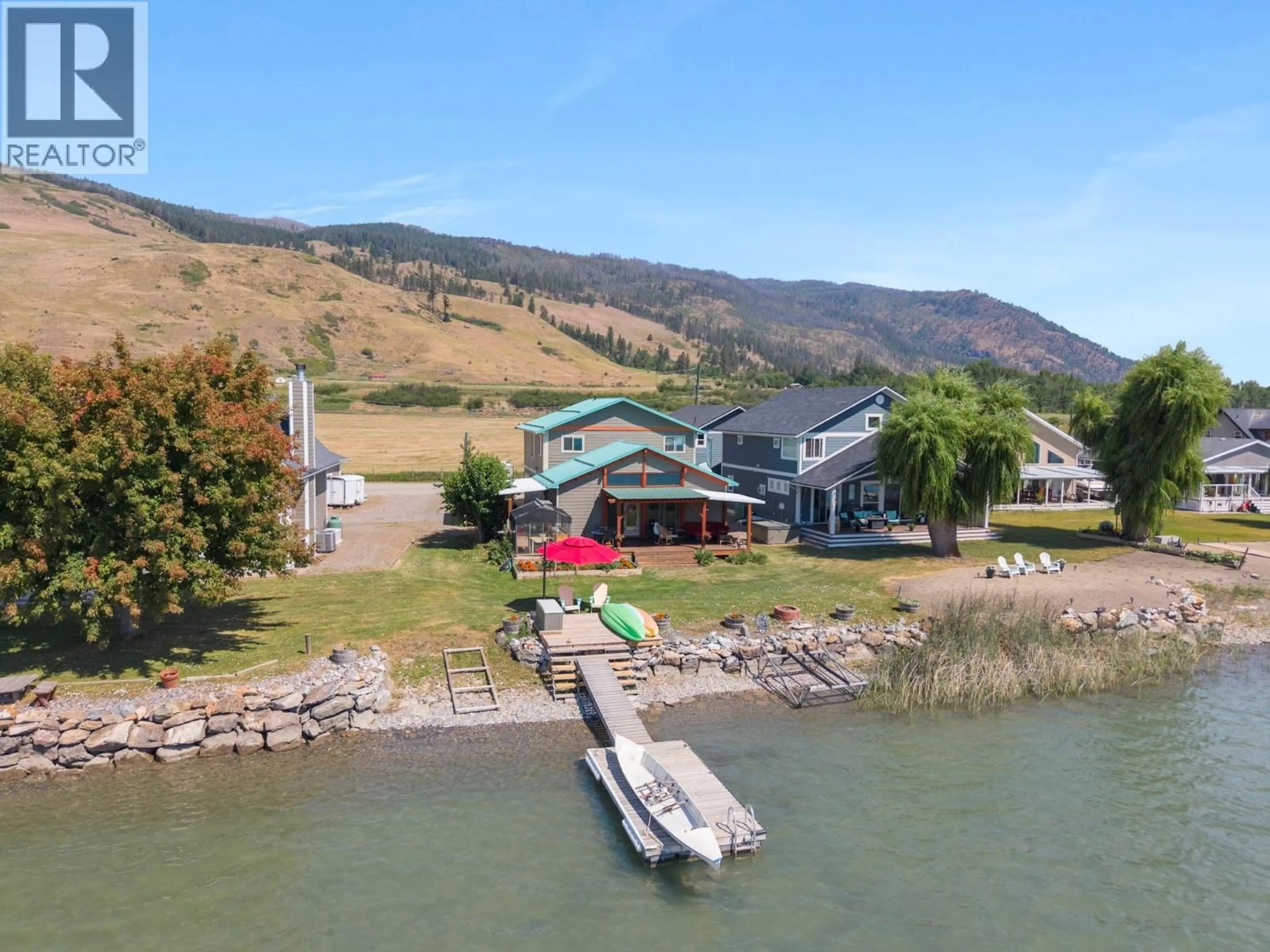 A pic from outside/outdoor area/front of a property/back of a property/a pic from drone, water/lake/river/ocean view for 17 MARY'S EMERALD BAY ROAD, Vernon British Columbia V1H2A7