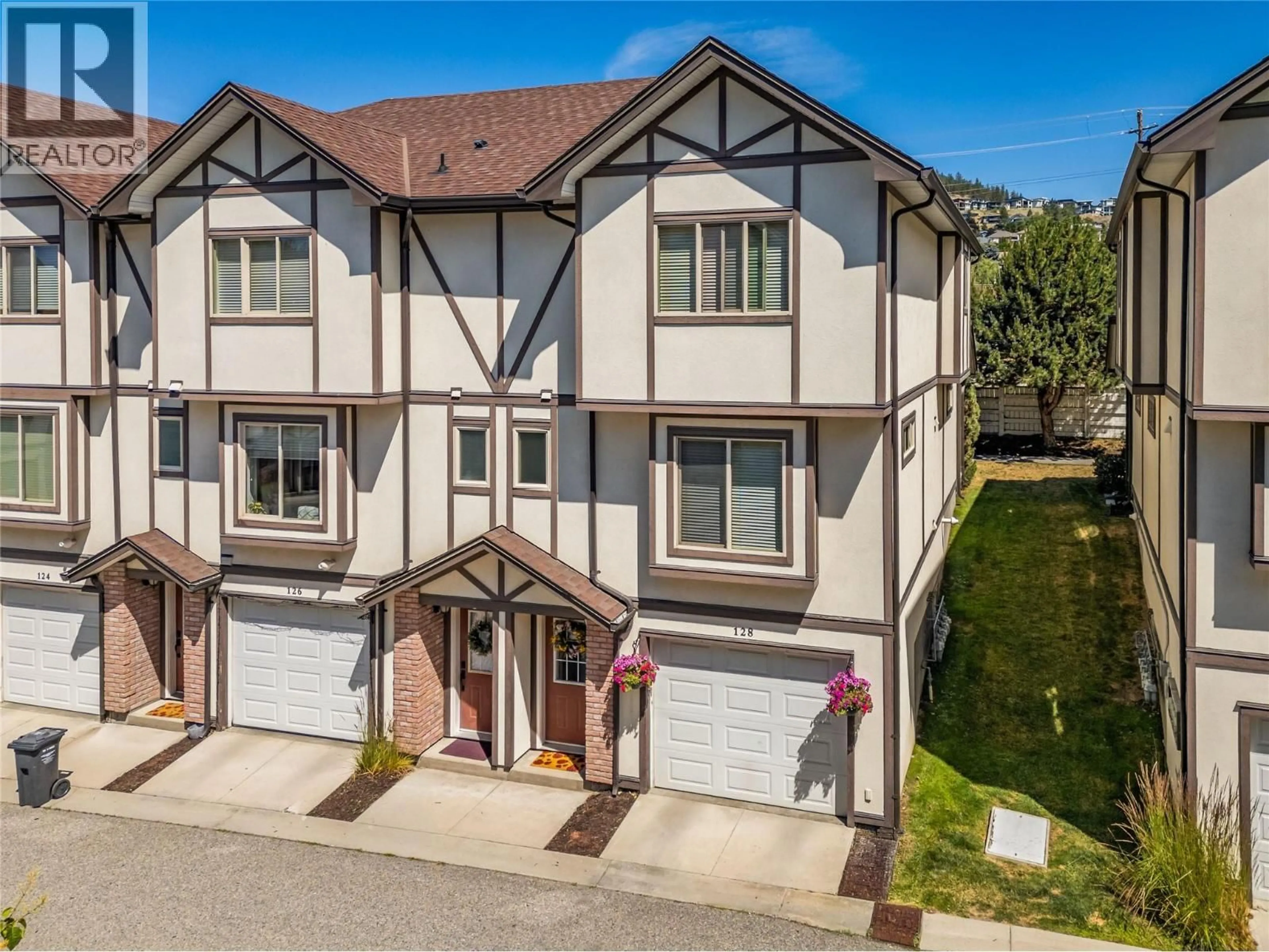 A pic from outside/outdoor area/front of a property/back of a property/a pic from drone, street for 128 - 128-1651 LYNRICK ROAD, Kelowna British Columbia V1P1R4