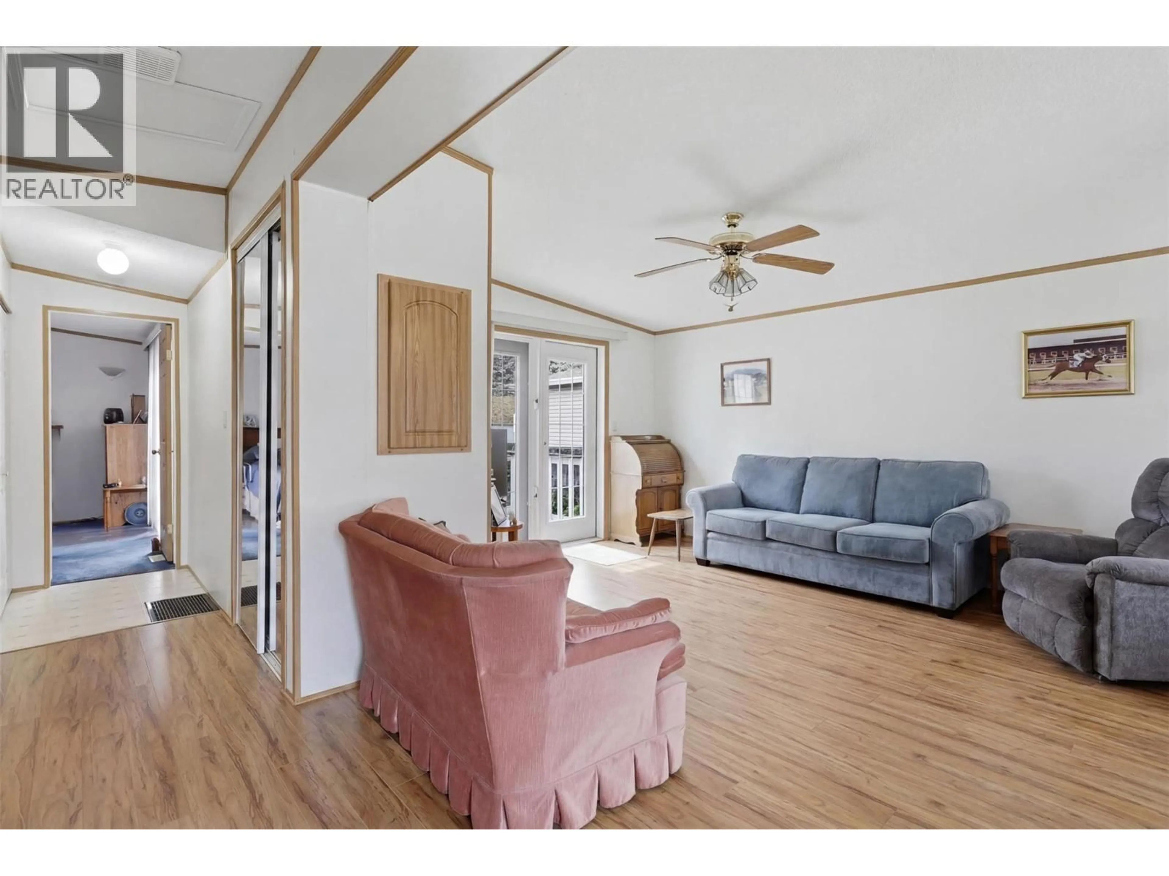 Living room with furniture, wood/laminate floor for 52 - 7545 DALLAS DRIVE, Kamloops British Columbia V2C6X8