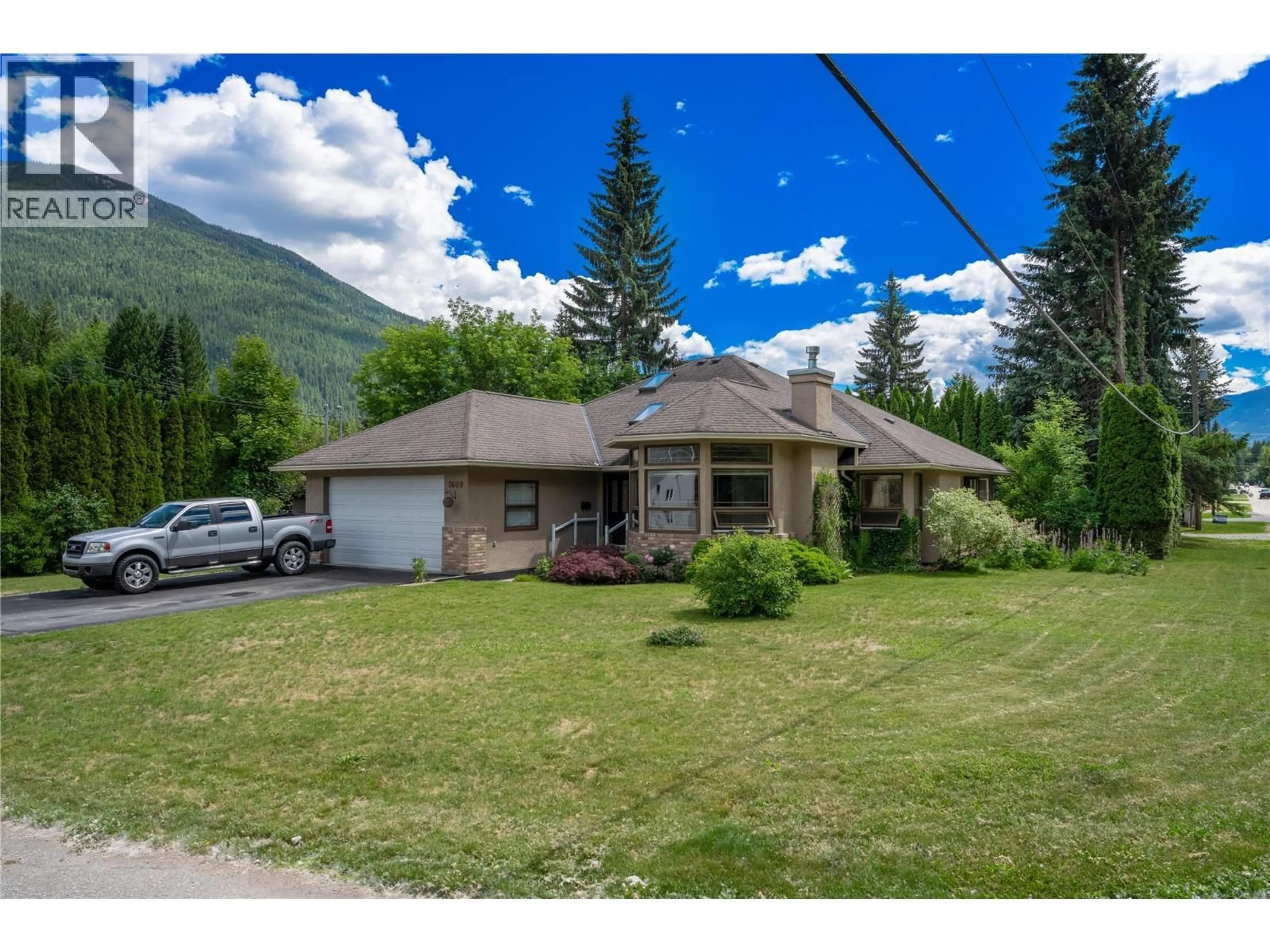 A pic from outside/outdoor area/front of a property/back of a property/a pic from drone, mountain view for 1609 WINDSOR DRIVE, Revelstoke British Columbia V0E2S1