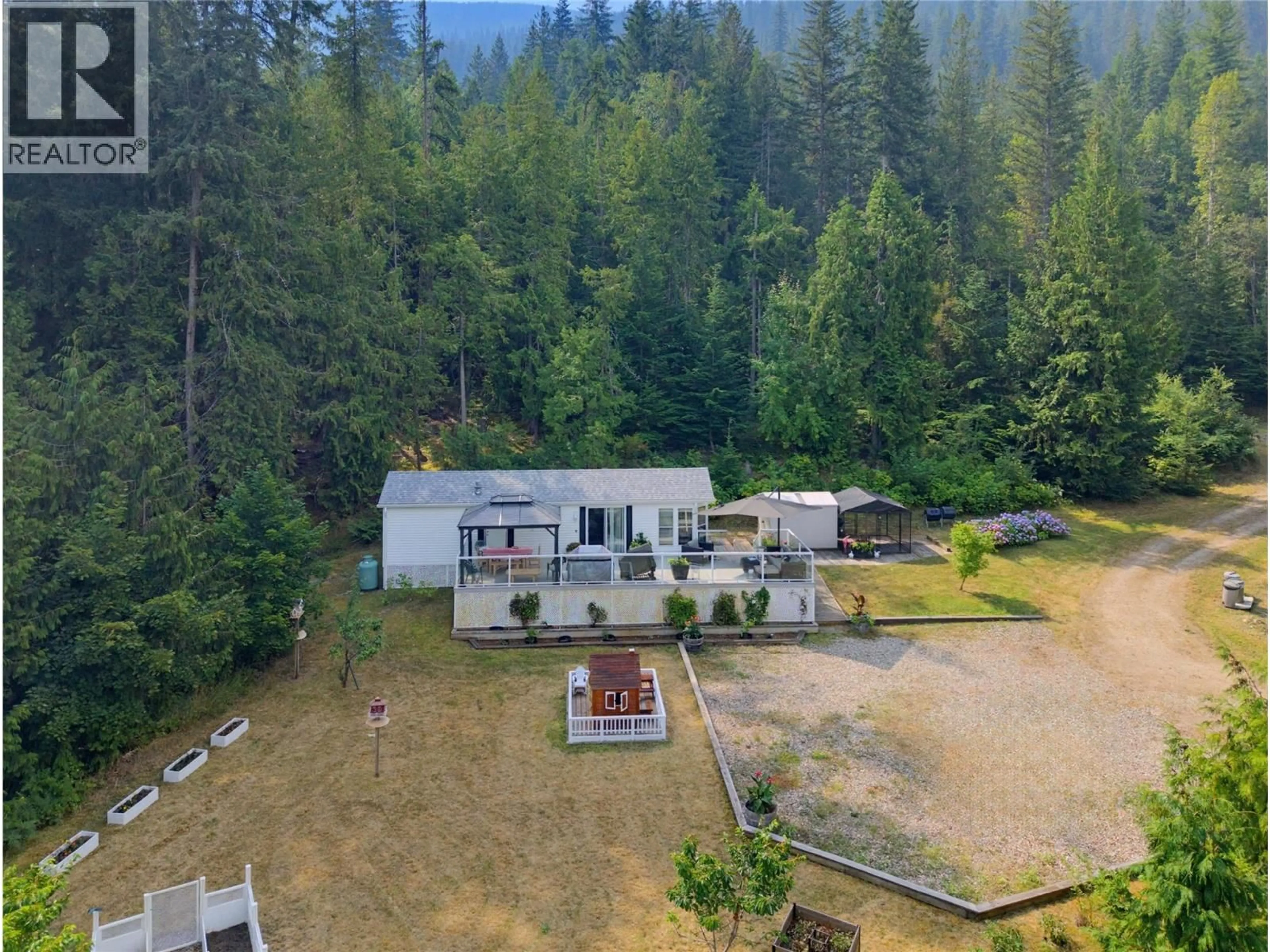 A pic from outside/outdoor area/front of a property/back of a property/a pic from drone, mountain view for 43 - 1249 BERNIE ROAD, Sicamous British Columbia V0E2K0