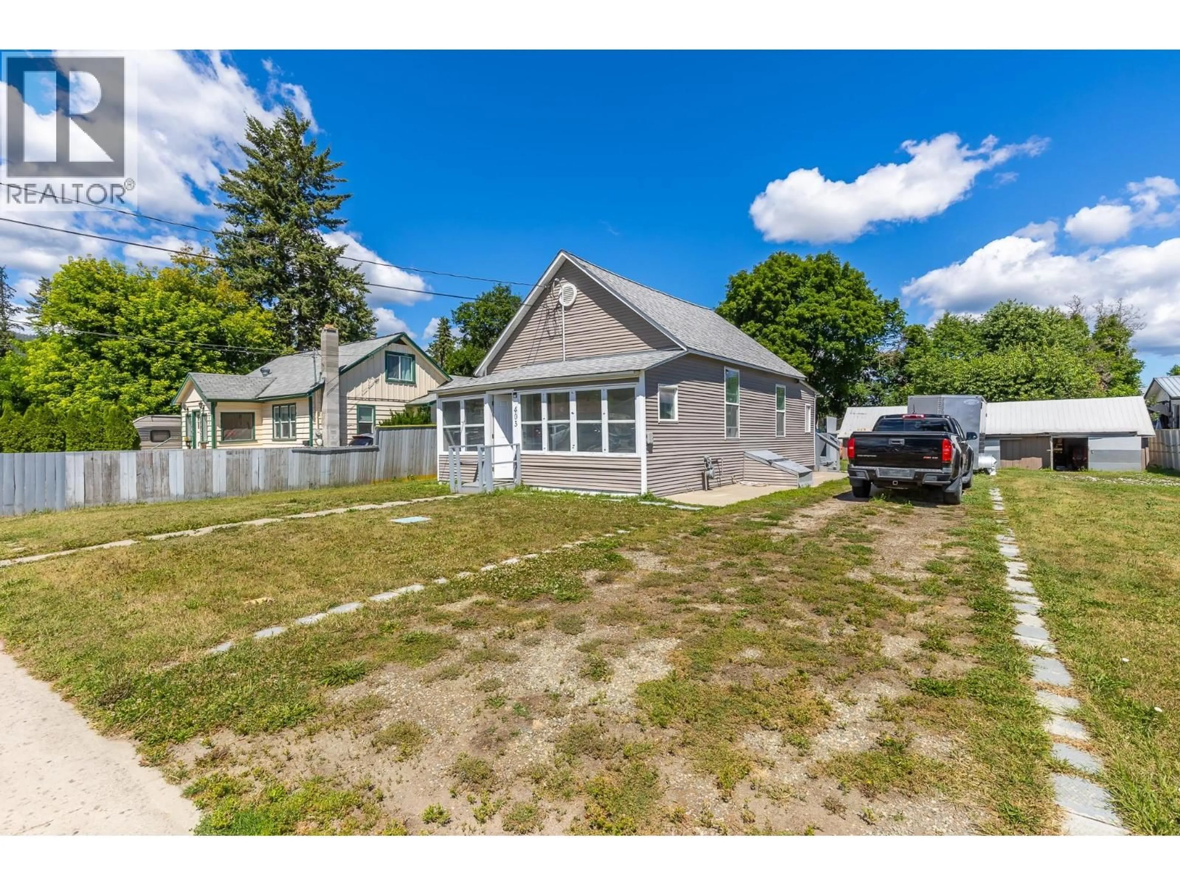 A pic from outside/outdoor area/front of a property/back of a property/a pic from drone, street for 403 HOWARD AVENUE, Enderby British Columbia V0E1V2