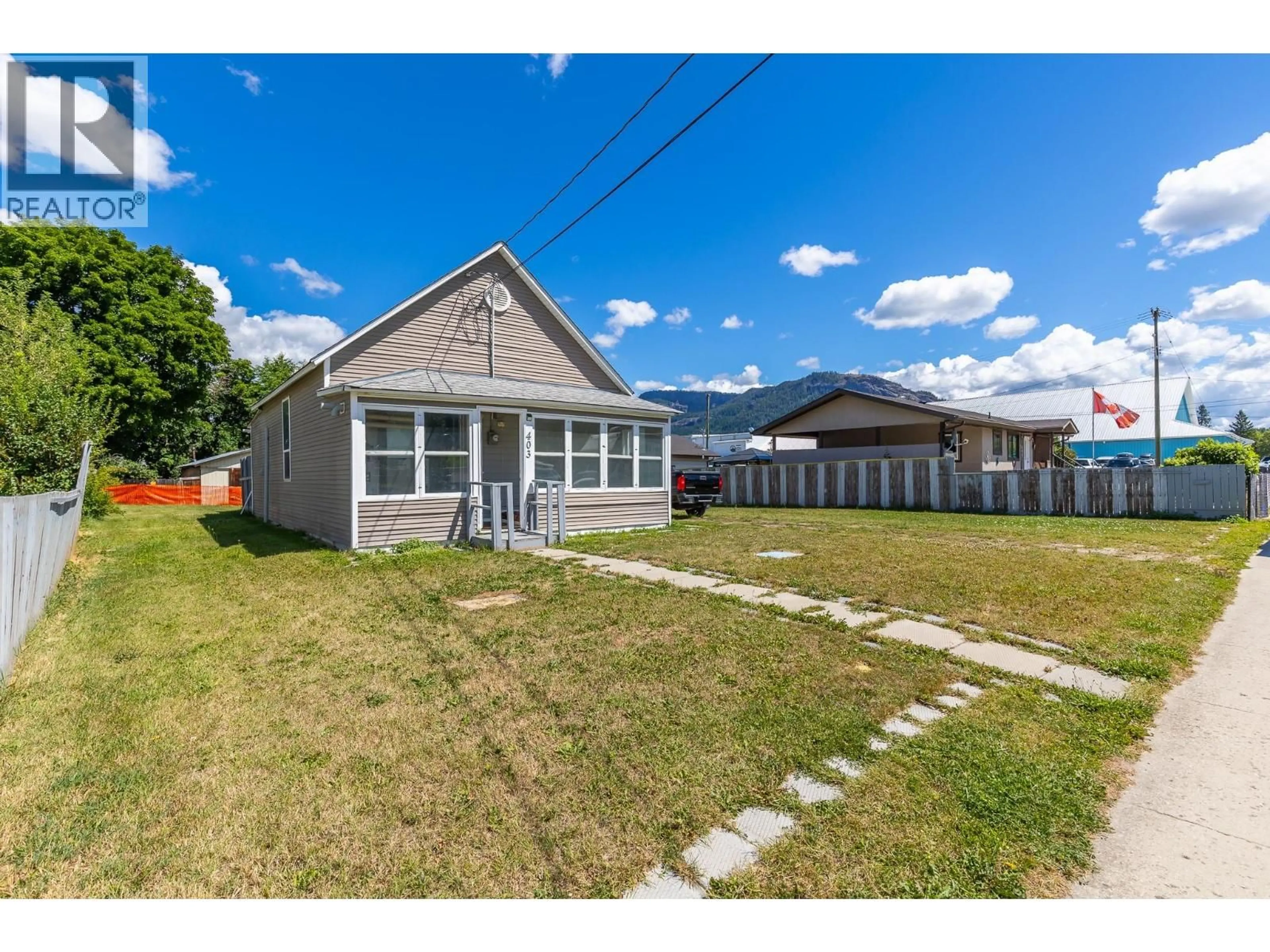 A pic from outside/outdoor area/front of a property/back of a property/a pic from drone, street for 403 HOWARD AVENUE, Enderby British Columbia V0E1V2