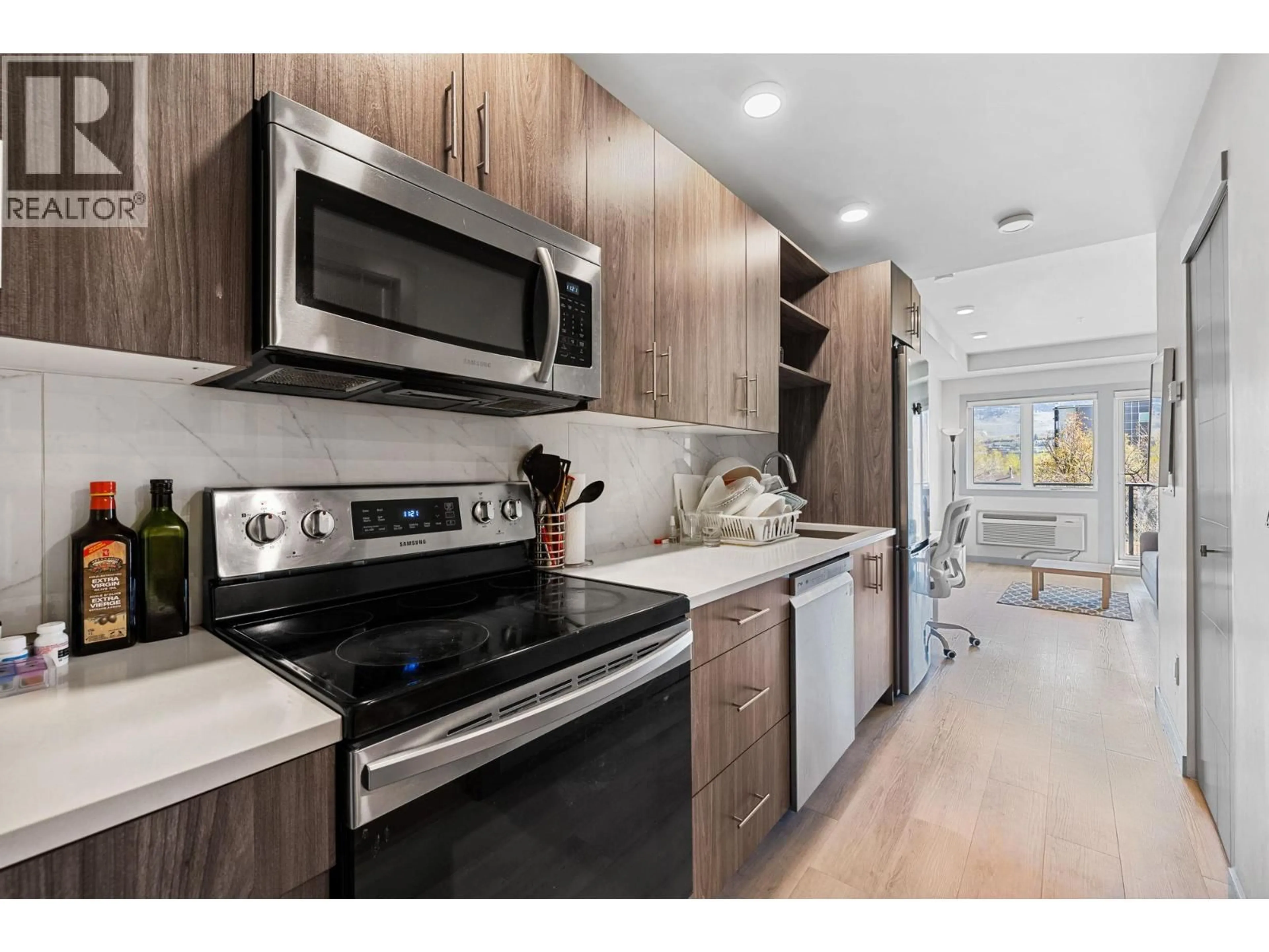 Open concept kitchen, wood/laminate floor for 220 - 345 DOUGALL ROAD NORTH, Kelowna British Columbia V1X0A8