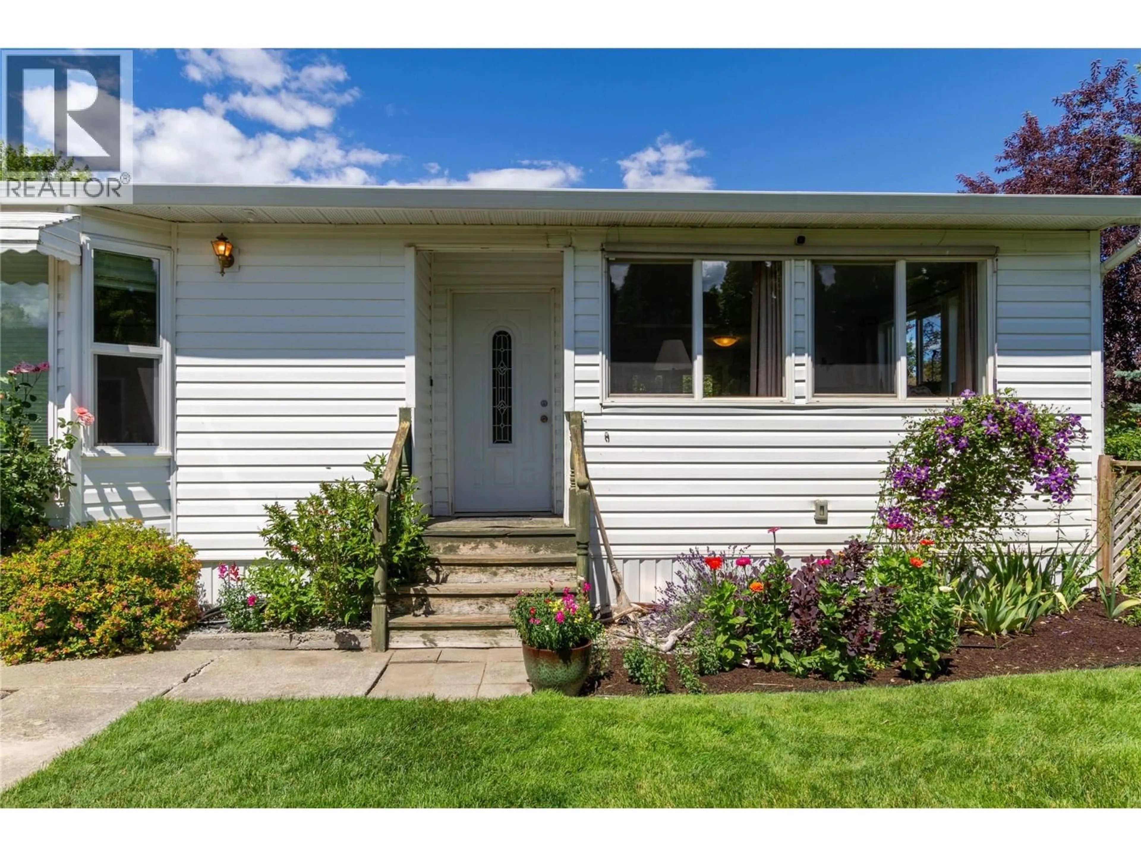Home with vinyl exterior material, street for 6235 CHUKAR ROAD, Vernon British Columbia V1H1M8