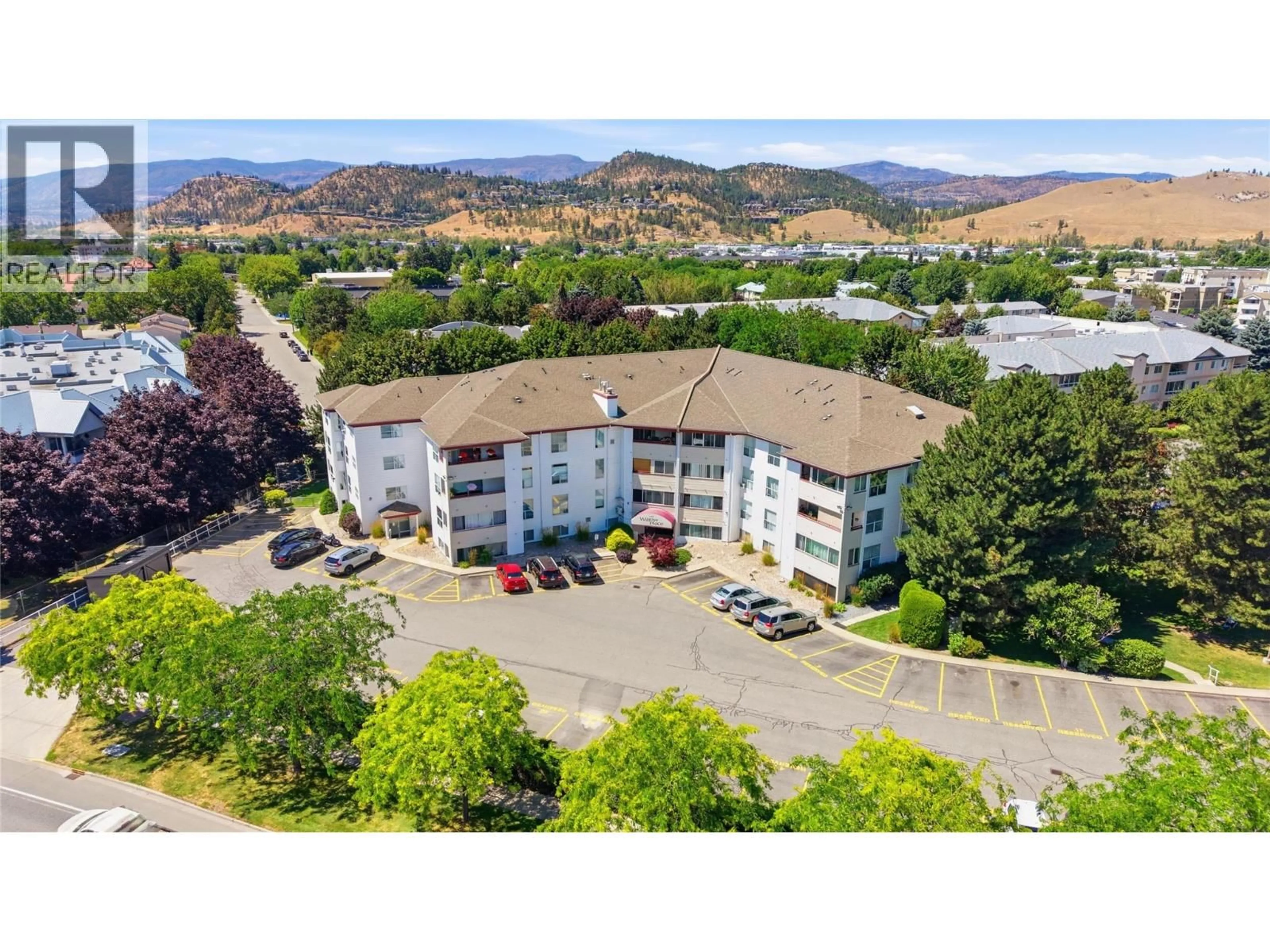 A pic from outside/outdoor area/front of a property/back of a property/a pic from drone, mountain view for 305 - 240 HOLLYWOOD ROAD NORTH, Kelowna British Columbia V1X6Y4