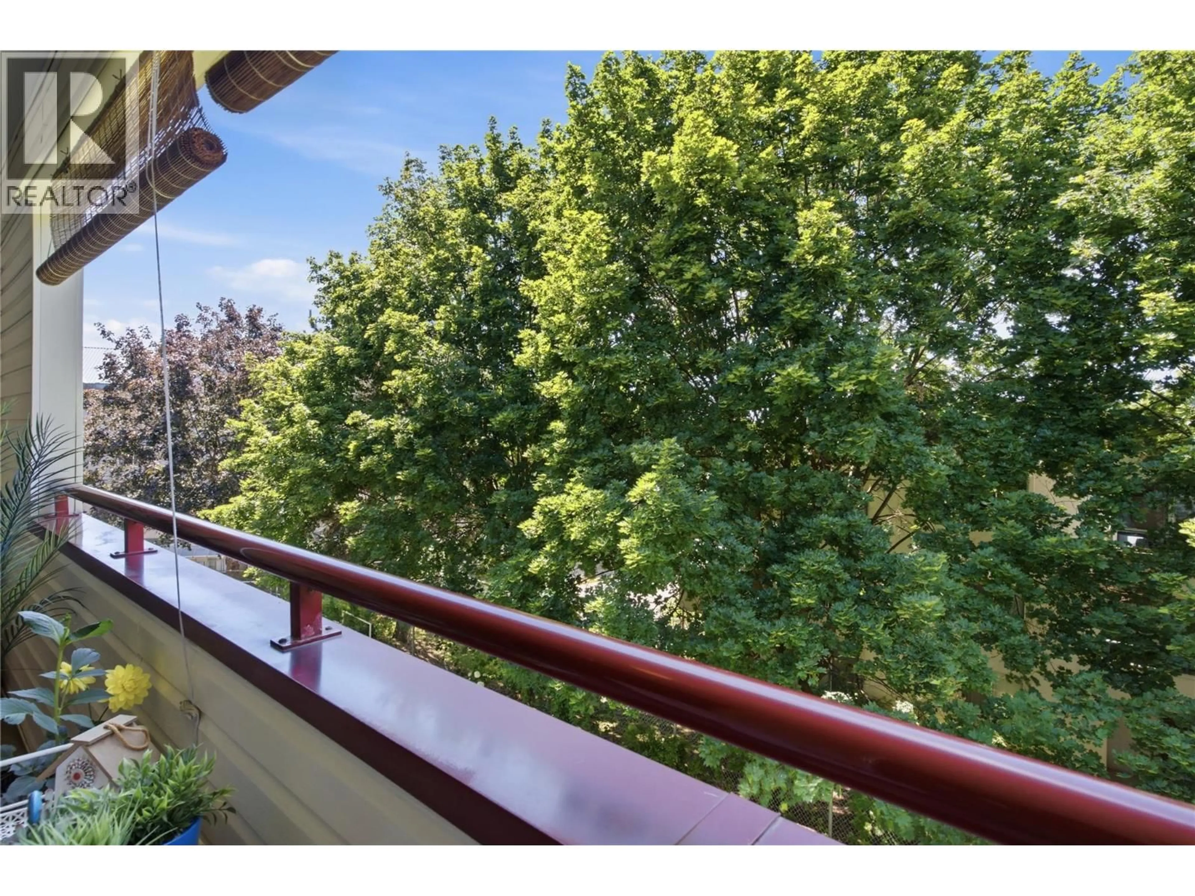 Balcony in the apartment, city buildings view from balcony for 305 - 240 HOLLYWOOD ROAD NORTH, Kelowna British Columbia V1X6Y4