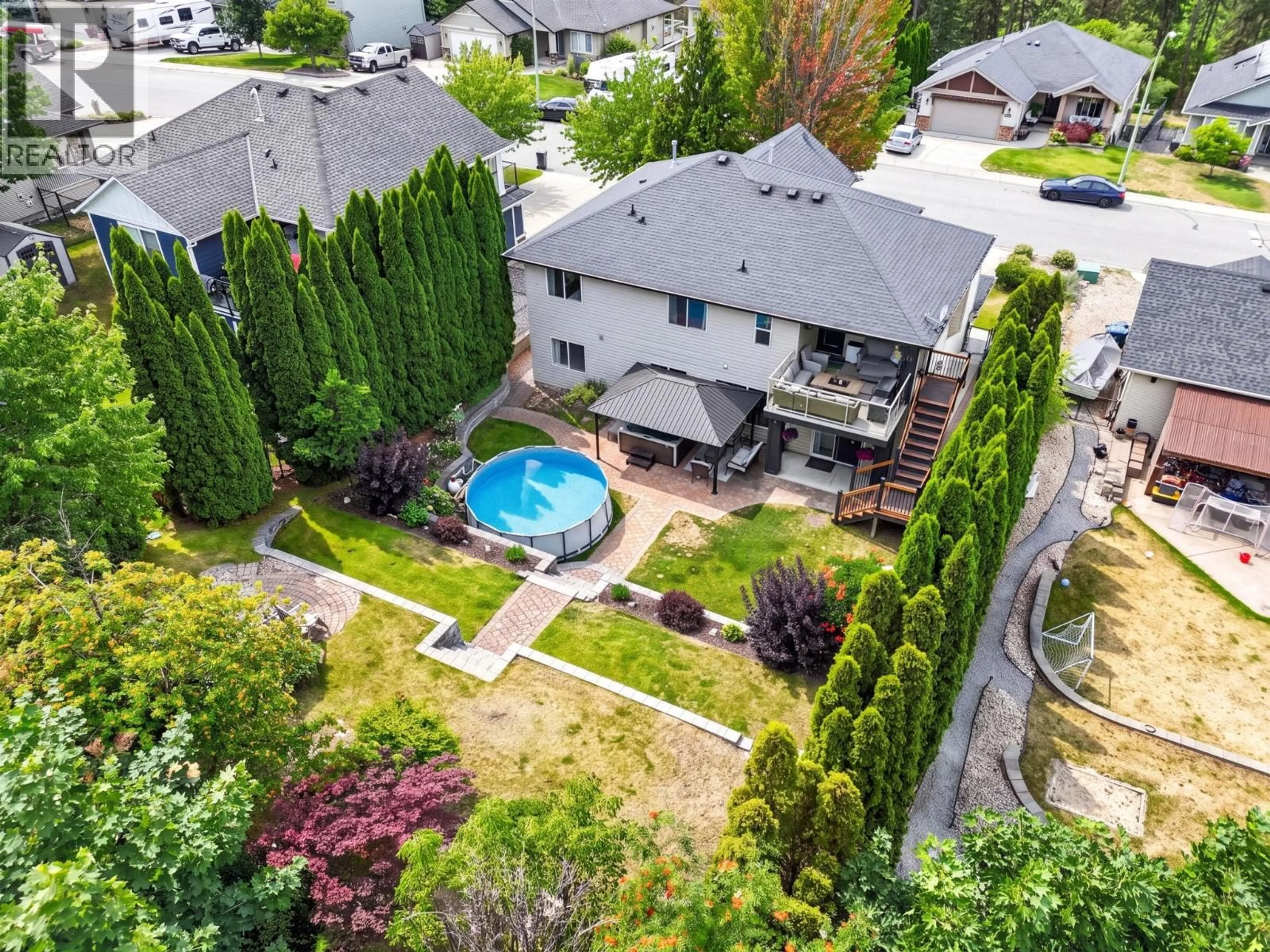 A pic from outside/outdoor area/front of a property/back of a property/a pic from drone, street for 10425 SHERMAN DRIVE, Lake Country British Columbia V4V2N2
