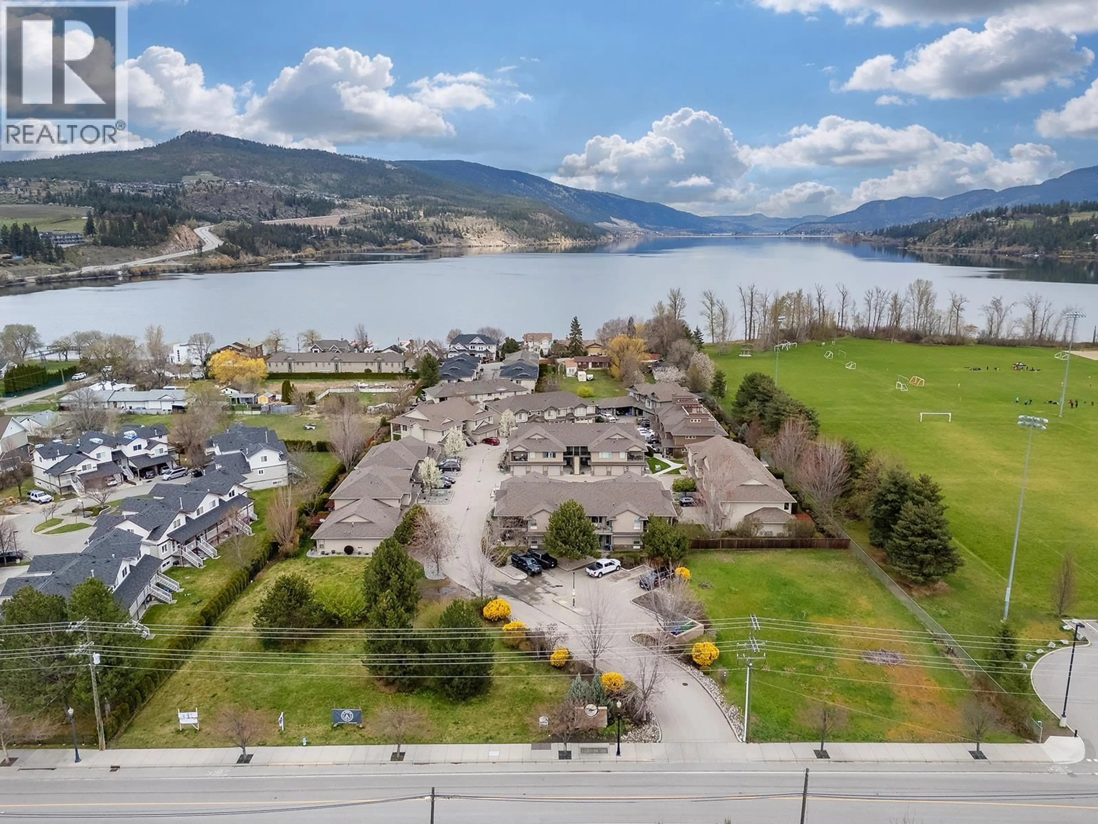 A pic from outside/outdoor area/front of a property/back of a property/a pic from drone, water/lake/river/ocean view for 401 - 3350 WOODSDALE ROAD, Lake Country British Columbia V4V2R7