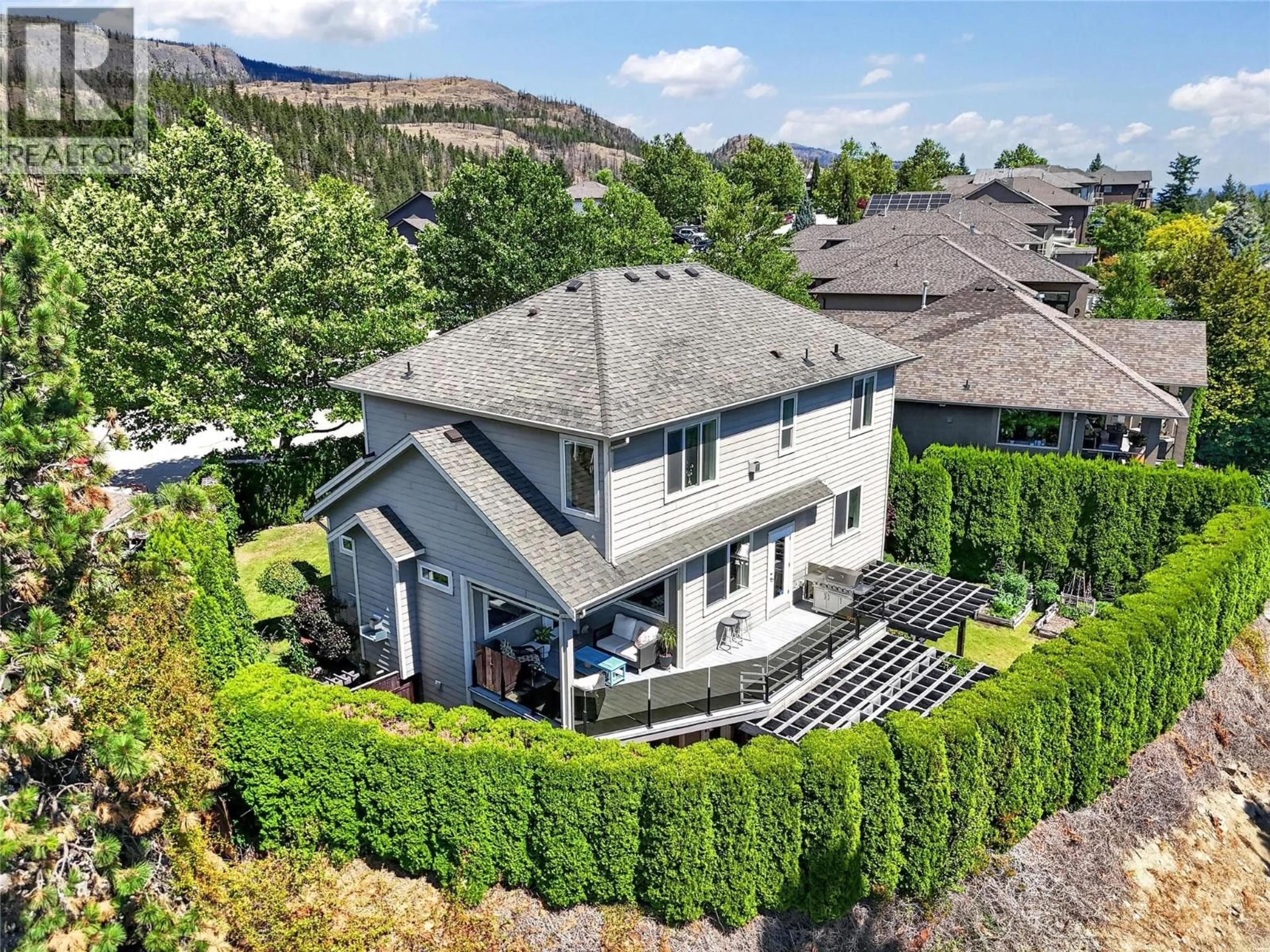 A pic from outside/outdoor area/front of a property/back of a property/a pic from drone, mountain view for 1124 PEAK POINT DRIVE, West Kelowna British Columbia V1Z4A9