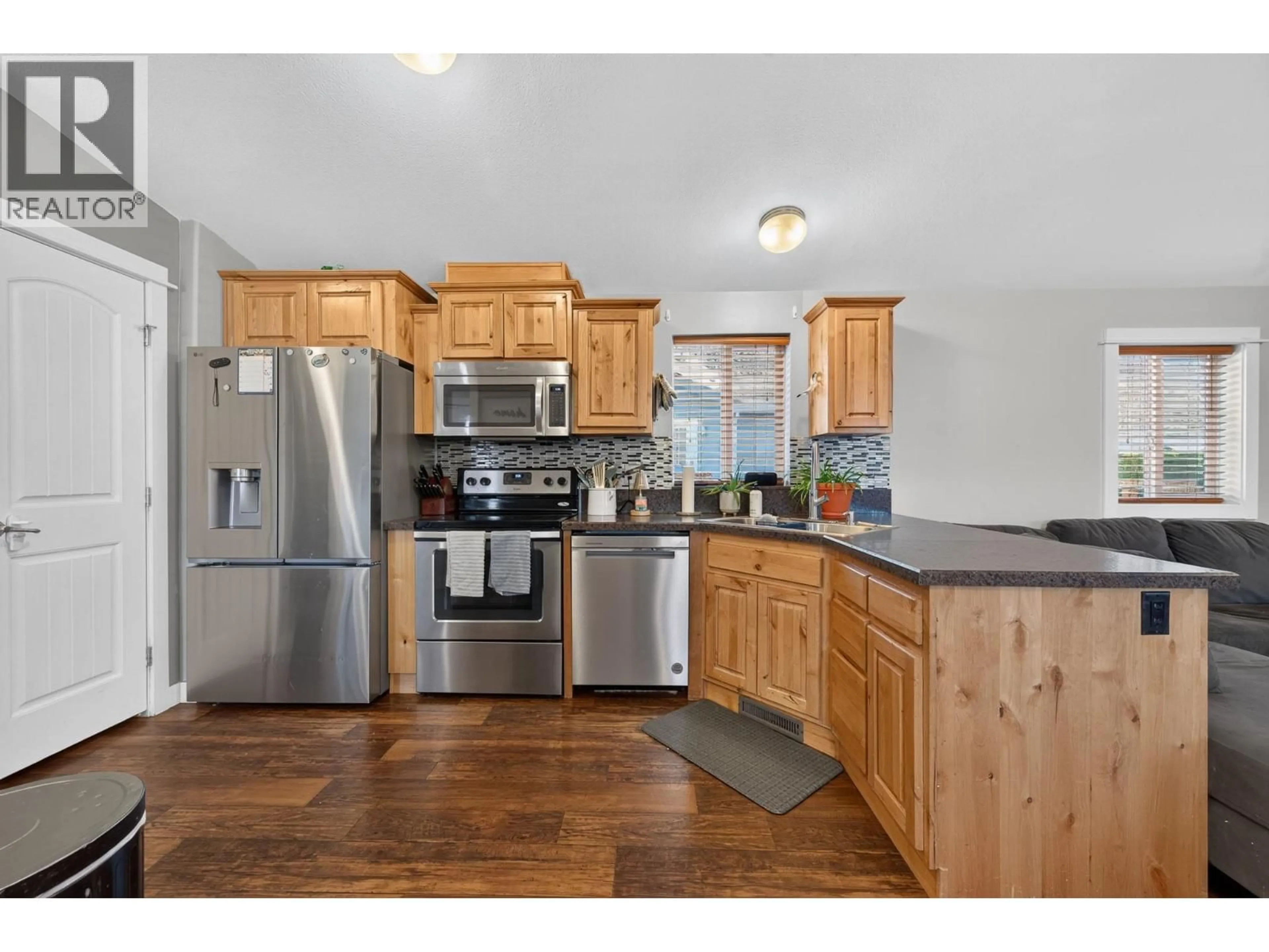 Open concept kitchen, wood/laminate floor for 6 - 712 SHUSWAP ROAD EAST, Kamloops British Columbia V2H0C8