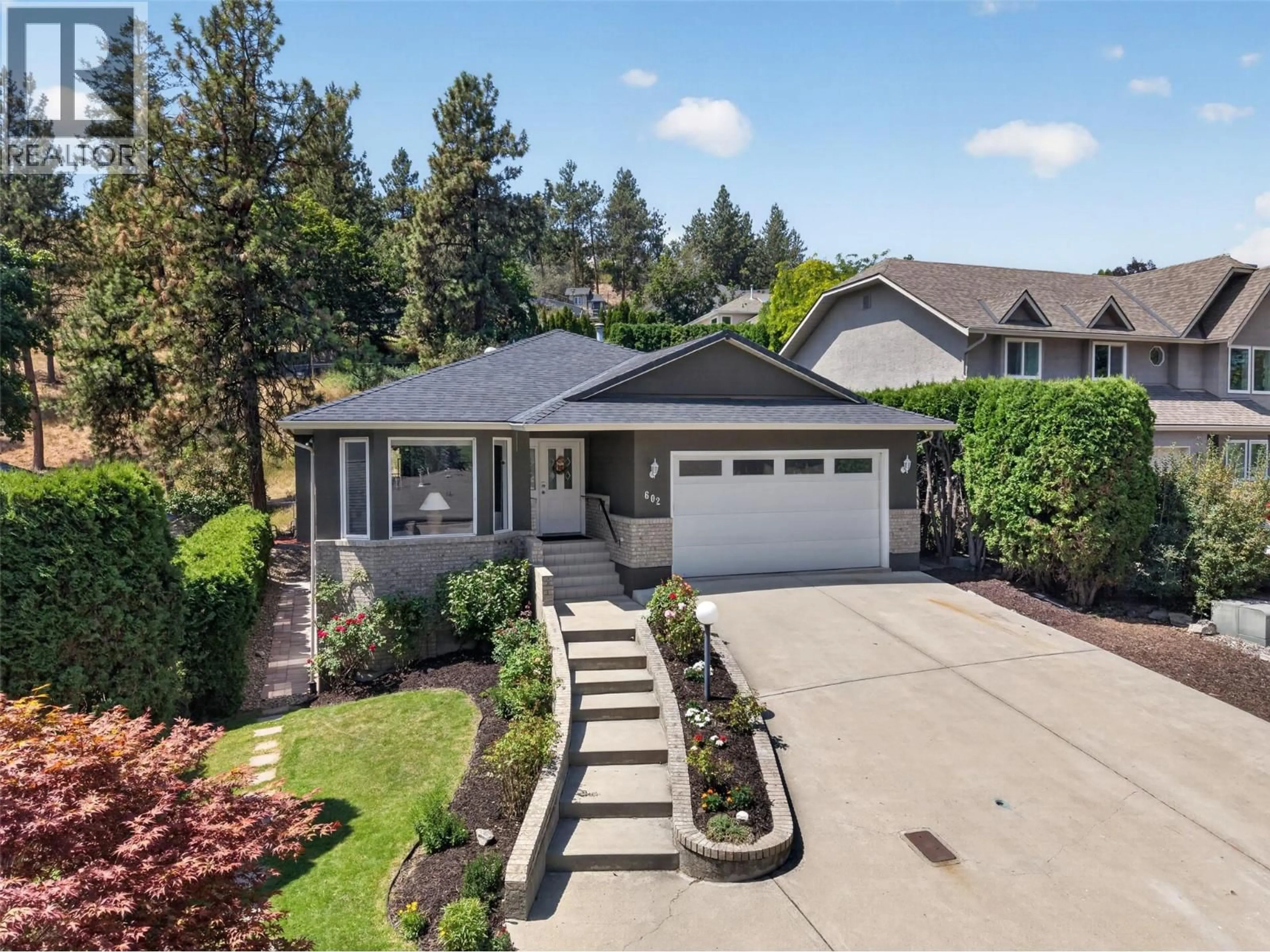 Home with vinyl exterior material, street for 602 GLENMEADOWS ROAD, Kelowna British Columbia V1V1P3