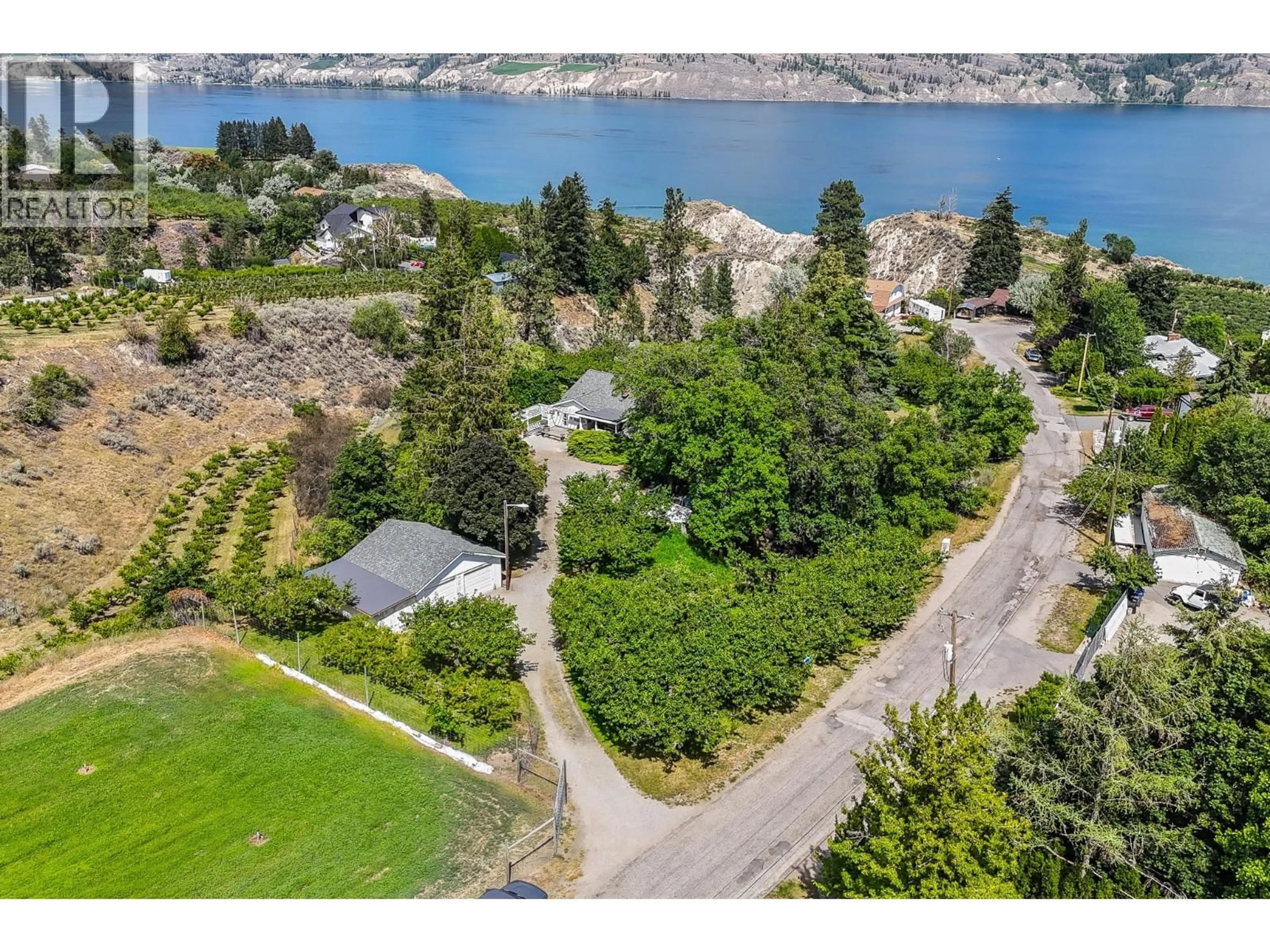 A pic from outside/outdoor area/front of a property/back of a property/a pic from drone, water/lake/river/ocean view for 7508 SWITCHBACK ROAD, Summerland British Columbia V0H1Z6