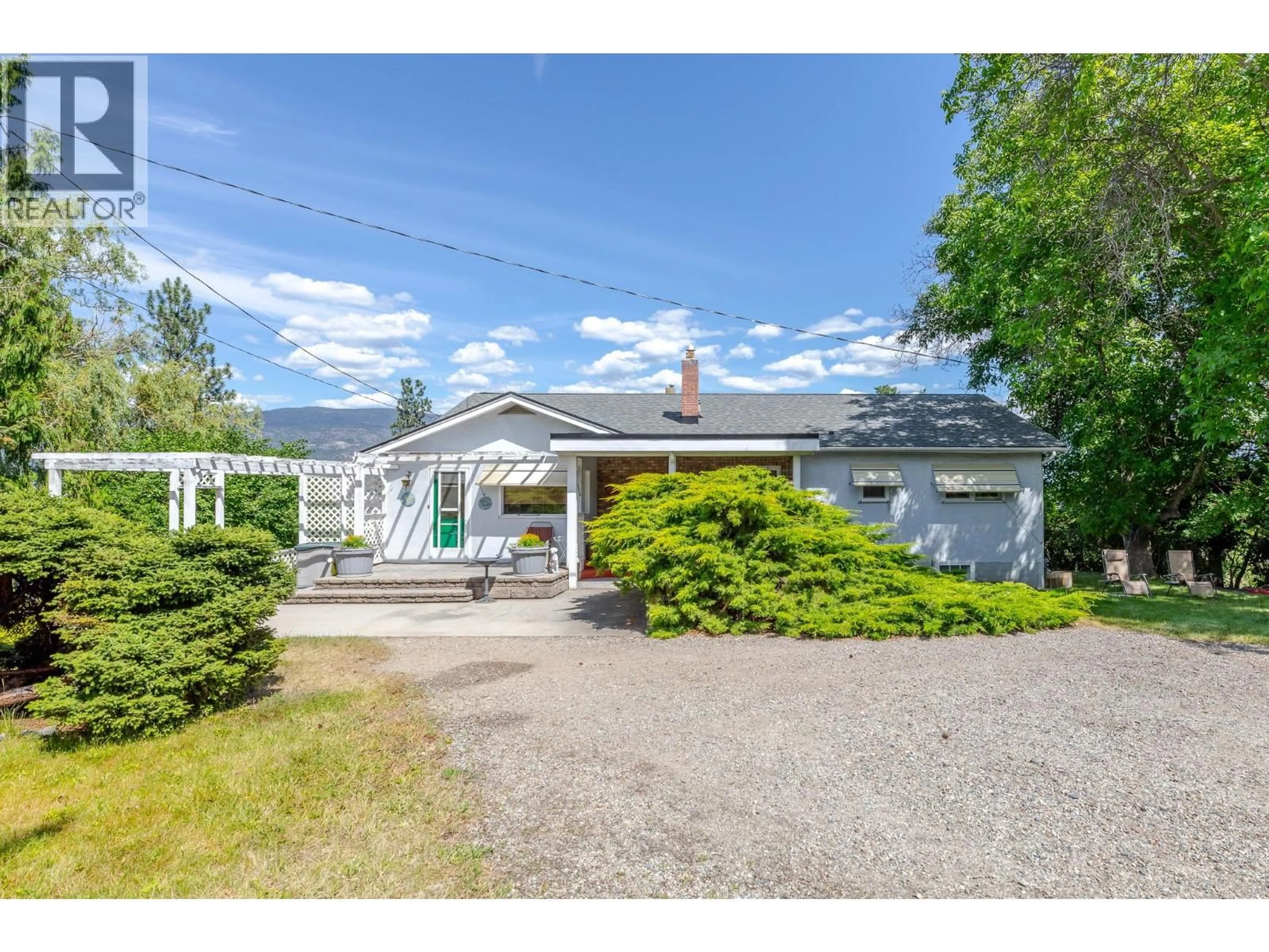 A pic from outside/outdoor area/front of a property/back of a property/a pic from drone, street for 7508 SWITCHBACK ROAD, Summerland British Columbia V0H1Z6