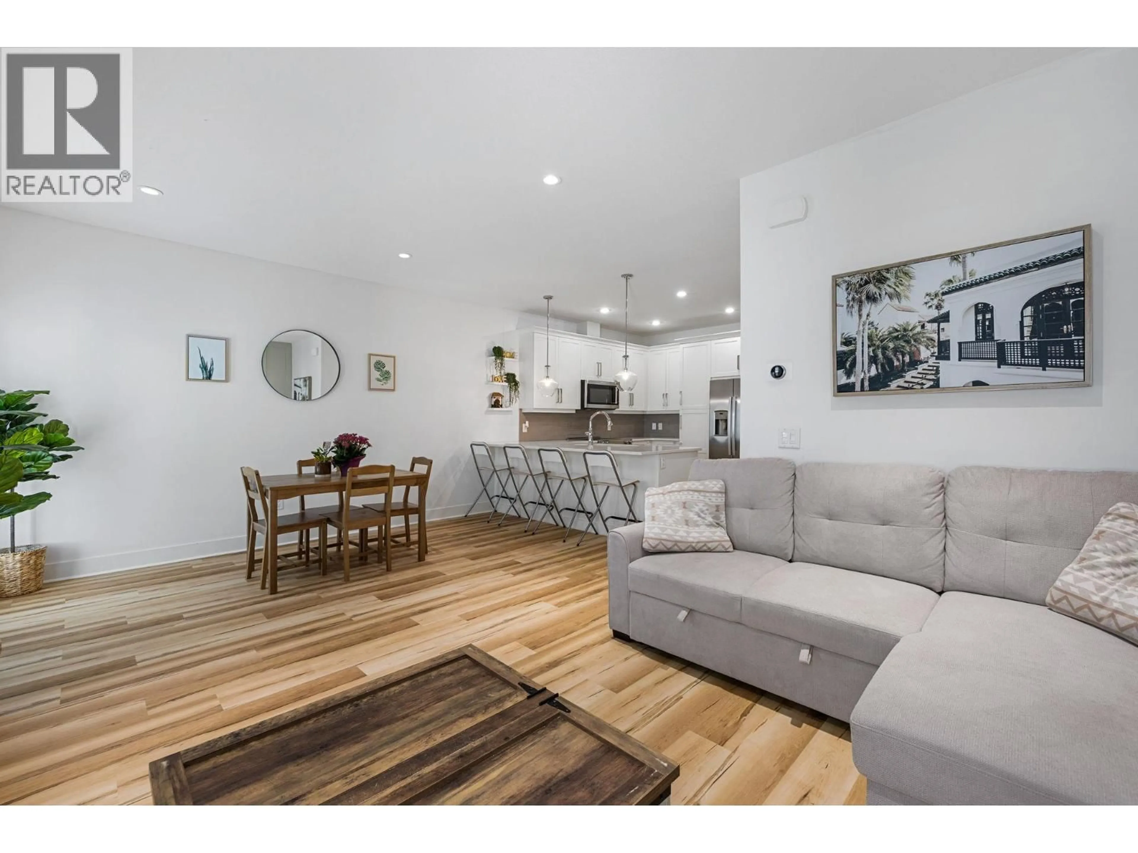 Living room with furniture, wood/laminate floor for 15 - 644 LEQUIME ROAD, Kelowna British Columbia V1W1A4